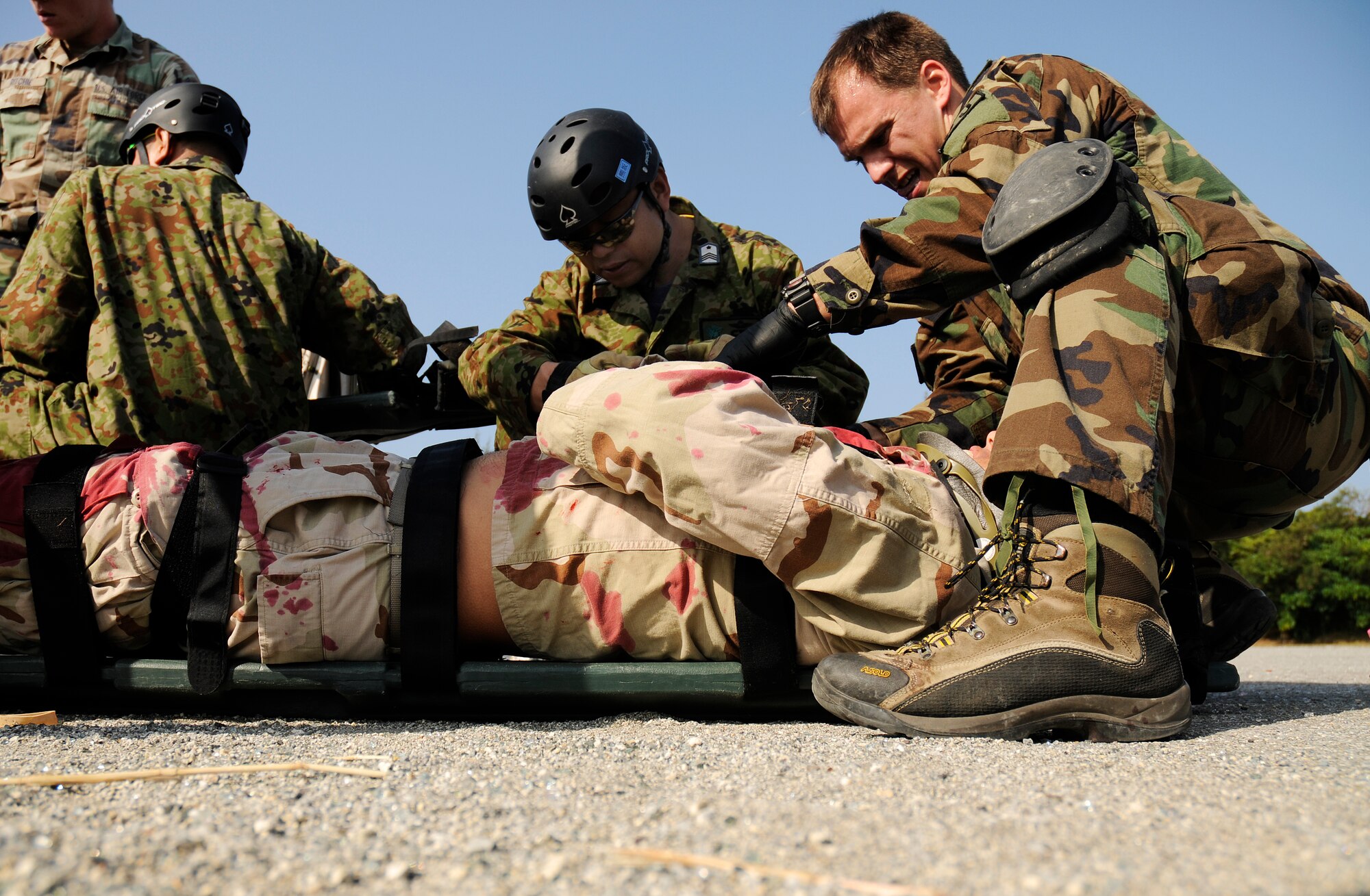 Senior Airman Smith, a pararescueman from the 31st Rescue Squadron at Kadena, treats a simulated survivor as part of a training scenario during exercise Cope Angel 09-1, Feb. 11, 2009. Cope Angel is a joint rescue exercise between members of the U.S. Air Force and the Japanese Air Self Defense Force. (U.S. Air Force photo/Airman 1st Class Chad Warren)