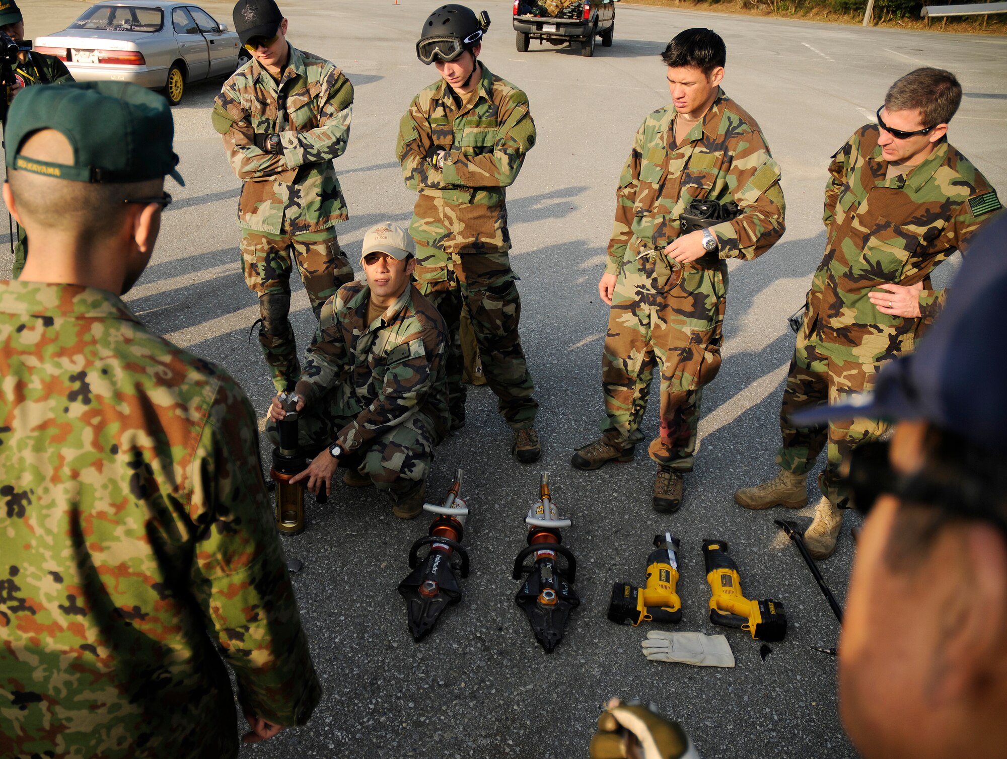 Staff Sgt. Ortega, a pararescueman assigned to the 31st Rescue Squadron, Kadena Air Base, Japan, briefs air rescue personnel from the Japanese Air Self Defense Force (JASDF) on how to properly use various pieces of demolition equipment during exercise Cope Angel 09-1, Feb. 11, 2009. Cope Angel is a joint rescue exercise between members of the U.S. Air Force and the JASDF. (U.S. Air Force photo/Airman 1st Class Chad Warren)