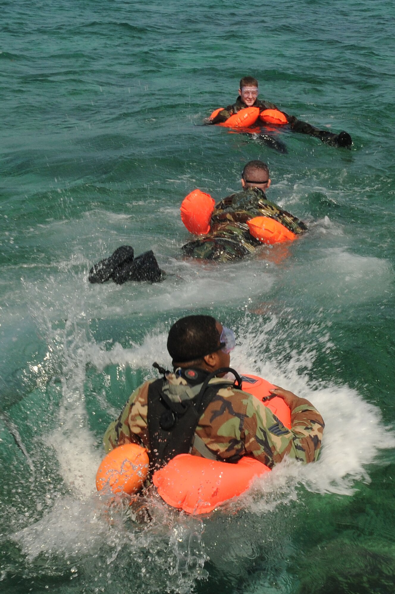 Simulated victims get in position to be assessed and rescued by Pararescuemen from the 31st Rescue Squadron, assigned to Kadena Air Base  Japan, as part of a training scenario  during exercise Cope Angel 09-1, Feb. 12, 2009. Cope Angel is a joint rescue exercise between members of the U.S. Air Force and the Japanese Air Self Defense Force.  (U.S. Air Force photo/Staff Sgt Chrissy Best)
