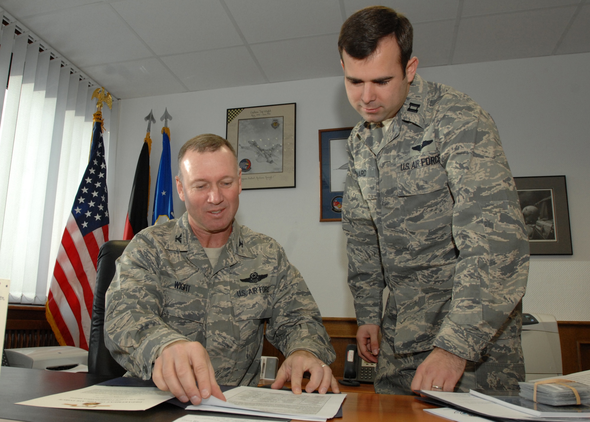 SPANGDAHLEM AIR BASE, Germany -- Capt. Michael Sward, 606th Air Control Squadron, shadows Col. Lee Wight, 52nd Fighter Wing commander, Feb. 11, 2009. Capt. Sward, a native of Kokomo, Ind., spent the day with the commander gaining insight into roles and responsibilities of senior wing leadership in a one-on-one officer mentorship forum. (U.S. Air Force photo by Senior Airman Jenifer H. Calhoun)