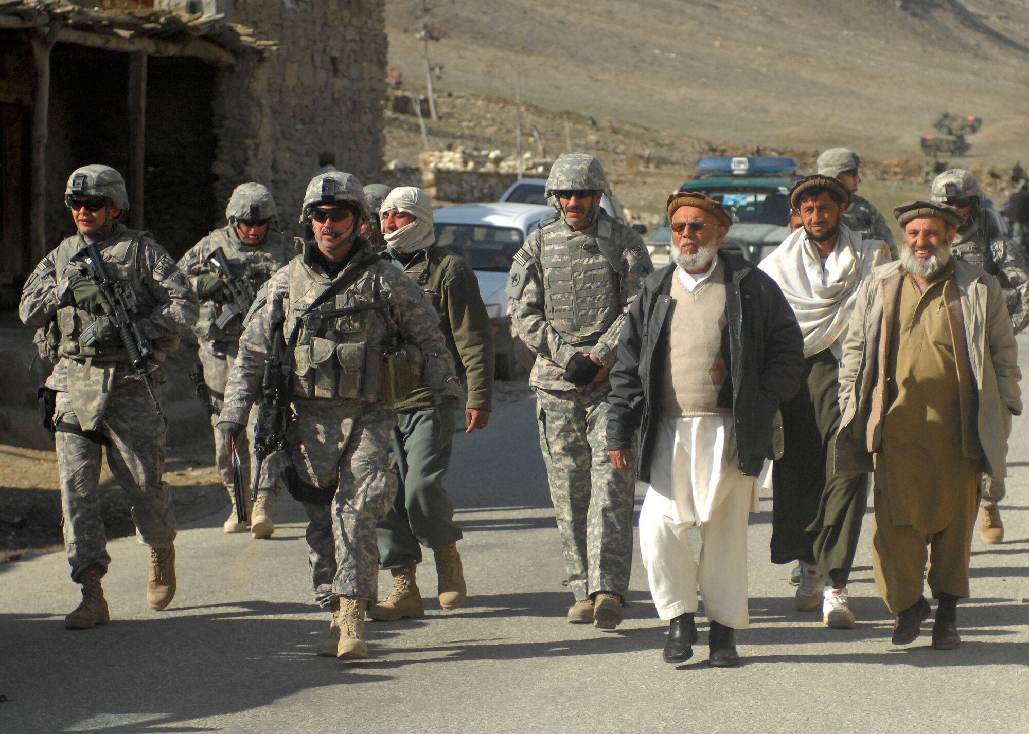 The Kapisa and Parwan Provincial Reconstruction Team, Task Force Warrior, escort the Deputy Governor and Provincial council members to meet with Governor Abubakr at Landokhel, Tagab, on Feb 7. U.S. and coalition forces along with Afghanistan National Security Forces provided air and ground support for a ribbon cutting ceremony for a refurbished mosque. The PRT mission is to improve the quality of life for local villagers and promote government stability. (U.S. Air Force photo/ Senior Airman Cardenas) 
