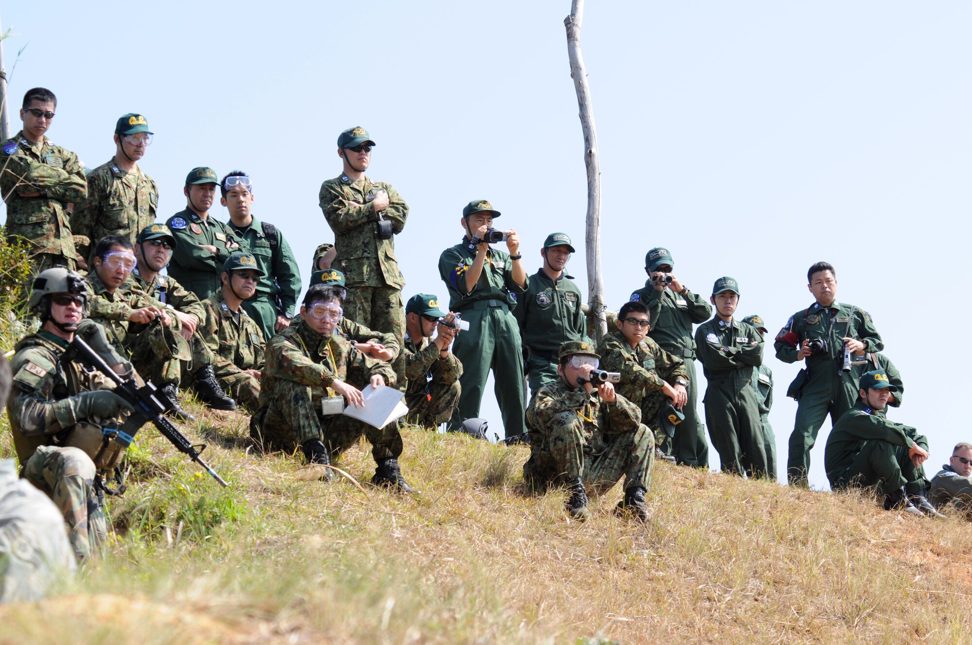 JASAF leadership and pararescuemen watch from above, during exercise Cope Angel 09-1, Feb. 10, 2009. Cope Angel is a joint rescue exercise between members of the U.S. Air Force and the Japanese Air Self Defense Force.  (U.S. Air Force photo/Staff Sgt Chrissy Best)