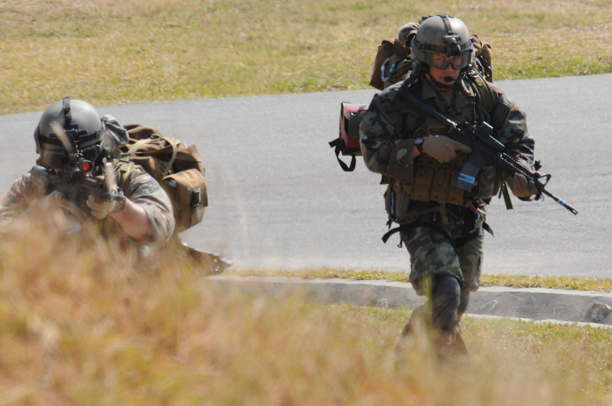 Pararescuemen assigned to 31st Rescue Squadron, Kadena Air Base, Japan engage the aggressors as part of a training scenario during exercise Cope Angel 09-1, Feb. 10, 2009. Cope Angel is a joint rescue exercise between members of the U.S. Air Force and the Japanese Air Self Defense Force.  (U.S. Air Force photo/Staff Sgt Chrissy Best)