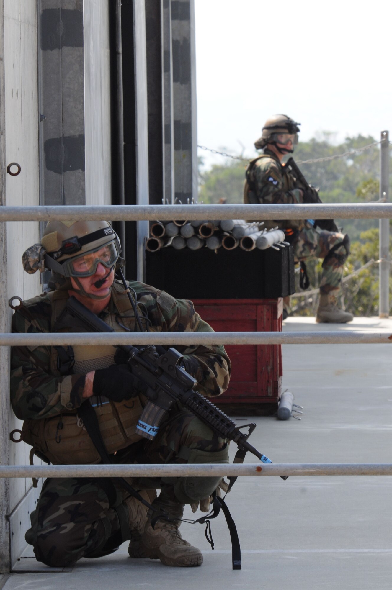 Pararescuemen assigned to the 31st Rescue Squadron at Kadena Air Base, Japan secure the building as part of a training scenario during exercise Cope Angel 09-1, Feb. 10, 2009. Cope Angel is a joint rescue exercise between members of the U.S. Air Force and the Japanese Air Self Defense Force.  (U.S. Air Force photo/Staff Sgt Chrissy Best)
