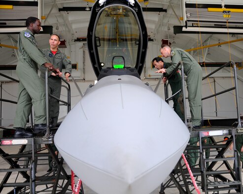 ANDERSEN AIR FORCE BASE, Guam - Lt. Gen. Edward Rice, United States Forces Japan commander, and Maj. Gen. Hideo Wakabayashi, Japan Air Self Defense Force 3rd Air Wing commander, toured an F-22A Raptor during their visit here Feb. 13. The F-22A show is deployed to Andersen with the 90th Expeditionary Fighter Squadron from Eielson AFB, Alaska, as part of the Theater Security Package.  The F-22A, a critical component of the Global Strike Task Force, is designed to project air dominance, rapidly and at great distances and defeat threats attempting to deny access to our nation's Air Force, Army, Navy and Marine Corps. The F-22A cannot be matched by any known or projected fighter aircraft. (U.S. Air Force photo by Airman 1st Class Courtney Witt)