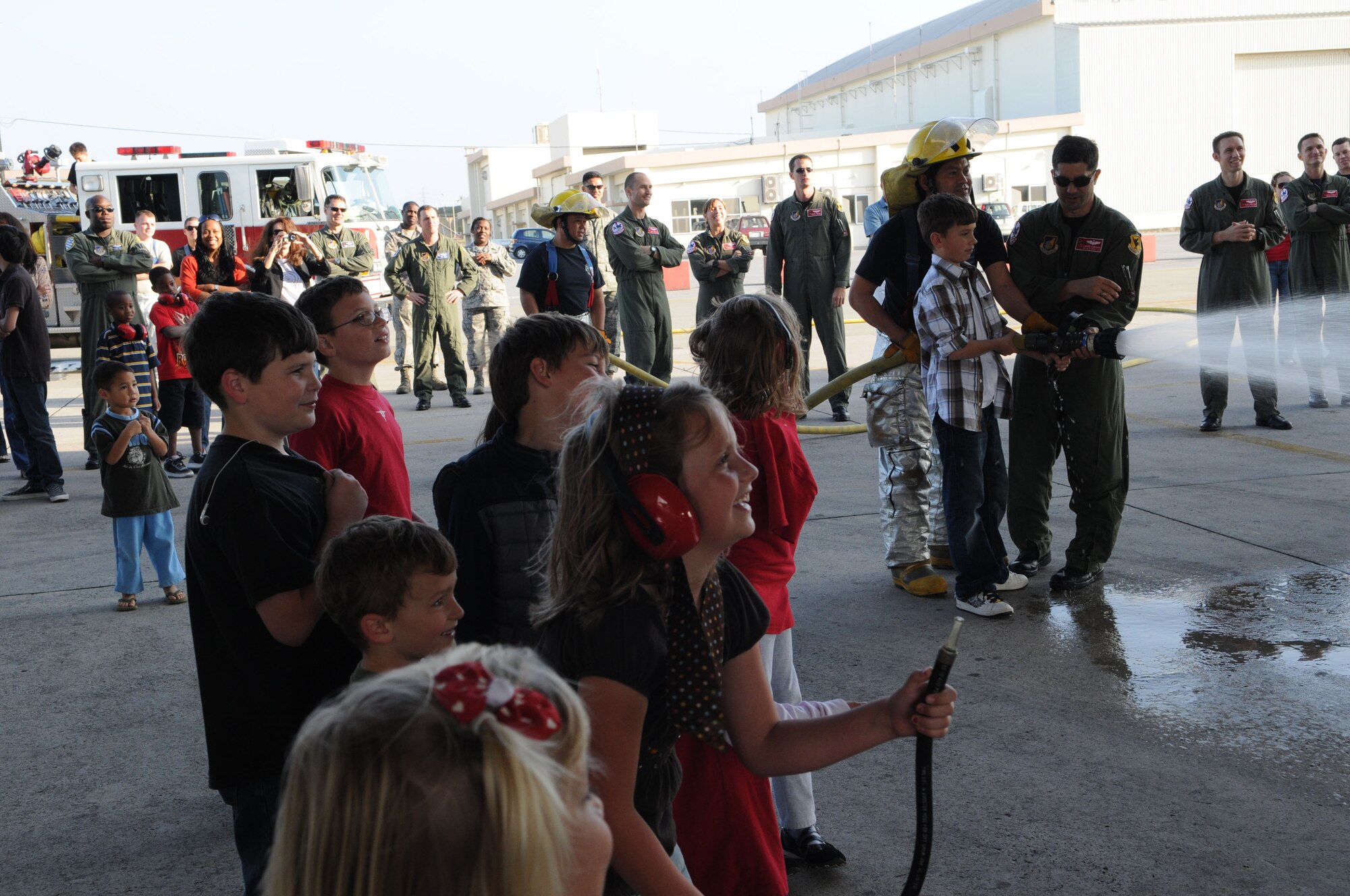 A crowd of coworkers, friends and family waits to greet Lt. Col. Robert Novotny, 67th Fighter Squadron commander, upon his return from a local training mission Feb. 12, 2009 at Kadena Air Base, Japan. On this mission, Colonel Novotny became one of only four pilots at Kadena to have surpassed 2,000 flying hours in the F-15 (U.S. Air Force photo/Staff Sgt. Darnell Cannady).