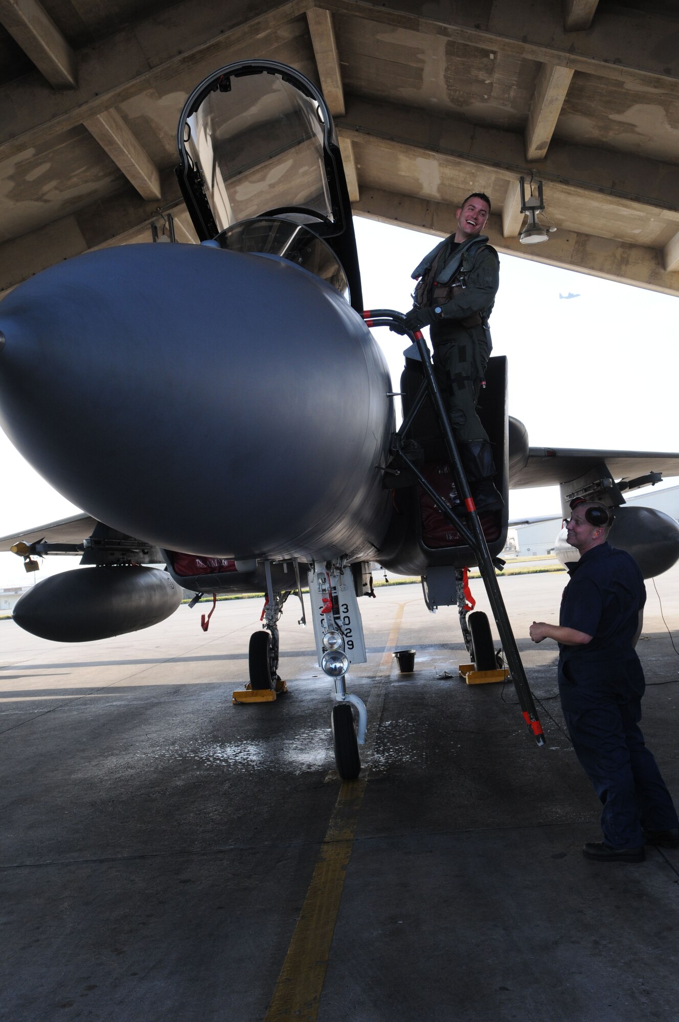 Lt. Col. Robert Novotny, 67th Fighter Squadron commander climbs out of the cockpit of an F-15 after completing a local training mission Feb. 12, 2009 at Kadena Air Base, Japan. On this mission, Colonel Novotny became one of only four pilots at Kadena to have surpassed 2,000 flying hours in the F-15.