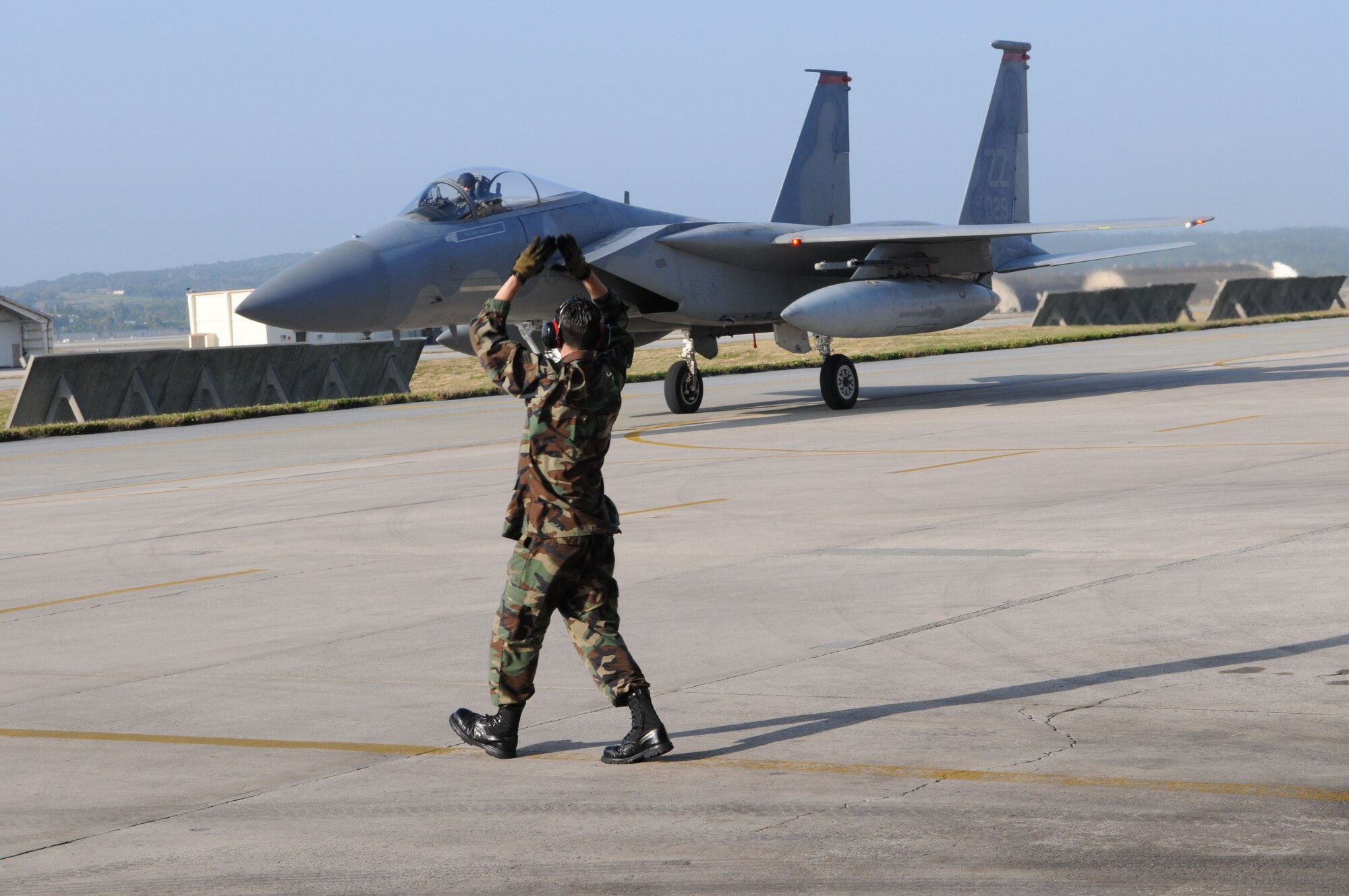 Lt. Col. Robert Novotny, 67th Fighter Squadron commander taxis his F-15 back to its parking spot after completing a local training mission Feb. 12, 2009 at Kadena Air Base, Japan. On this mission, Colonel Novotny became one of only four pilots at Kadena to have surpassed 2,000 flying hours in the F-15.