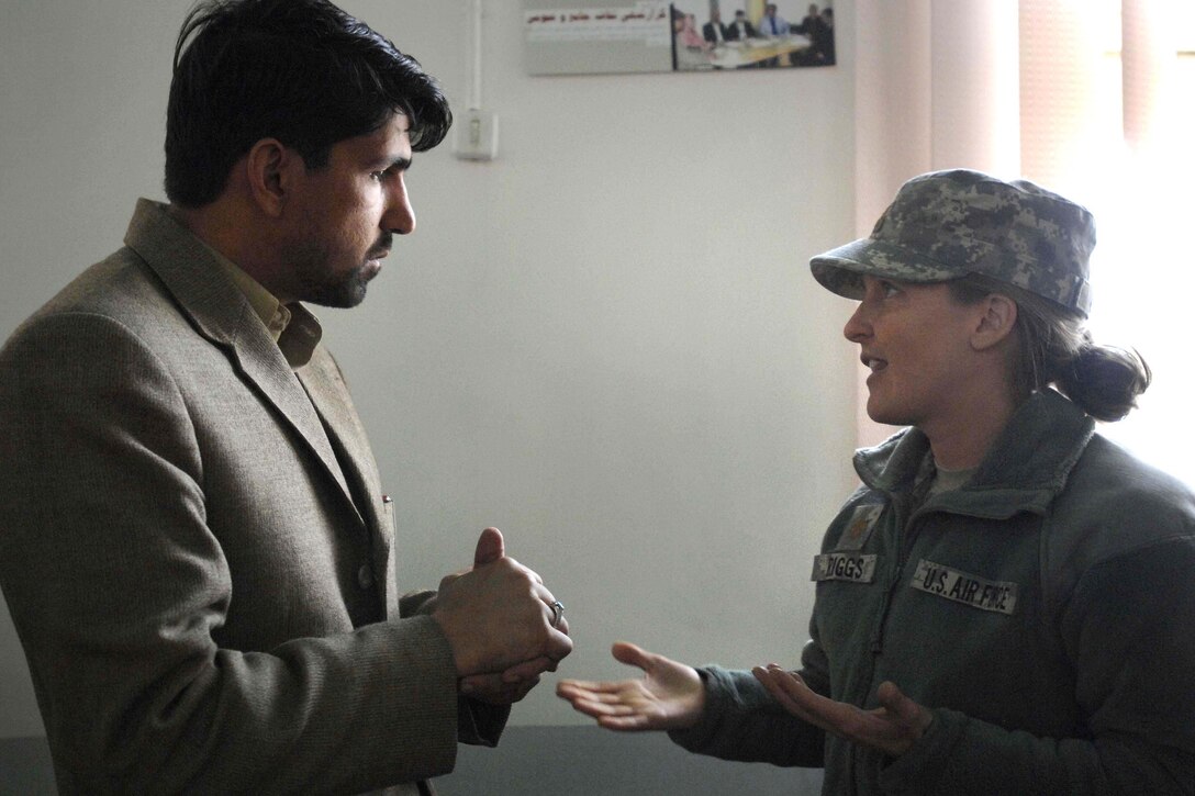 U.S. Air Force Maj. Kimberly Riggs, chief engineer for the provincial reconstruction team in Afghanistan’s Paktia province, listens to a contractor’s concerns during a conference, Feb. 7, 2009, at Gardez City, near Forward Operating Base Gardez.