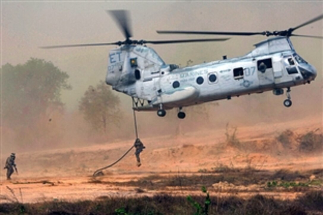 U.S. Marines and sailors and Royal Thai Marines, “fast rope” from a CH-46 Sea Knight helicopter during bilateral helicopter raid training, Samaesan, Thailand, Feb. 11, 2009. The Marines are assigned to Kilo Company, 3rd Battalion, 5th Marines, 31st Marine Expeditionary Unit. The Royal Thai Marines, along with about 7,000 U.S. servicemembers, are participating in Exercise Cobra Gold 2009 throughout the Kingdom of Thailand.