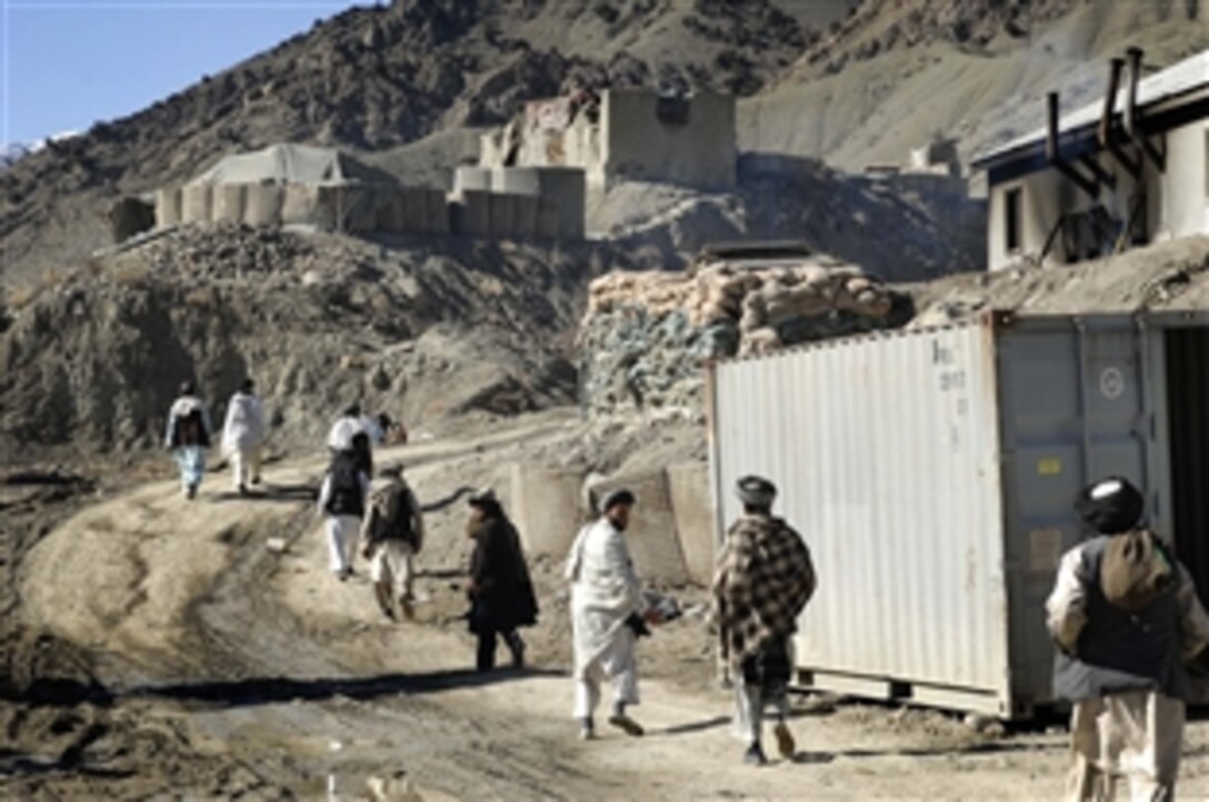 Tribal leaders walk to a wash point at Combat Outpost Wilderness to wash before afternoon prayers following a meeting there, Feb. 8, 2009, hosted by the Paktia provincial reconstruction team. About 40 tribal leaders from three districts turned out to meet the provincial governor. 