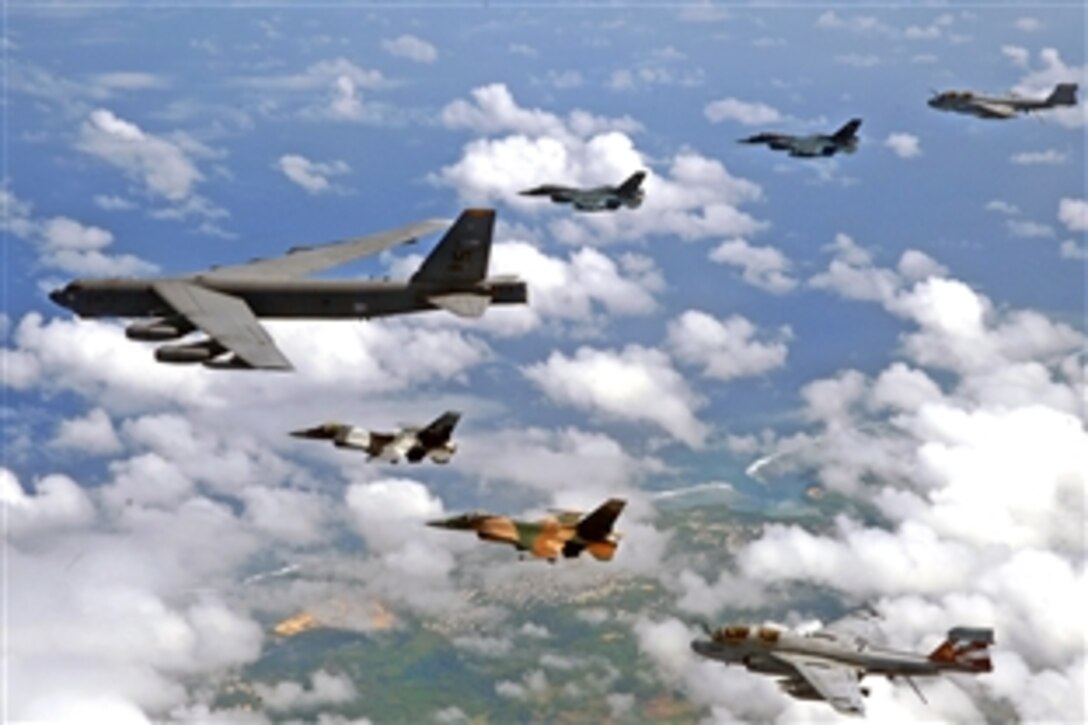 A U.S. Air Force B-52 Stratofortress leads a formation of Japanese Air Self Defense Force F-2s, U.S. Air Force F-16 Fighting Falcons, and a U.S. Navy EA-6B Prowlers over Guam, Feb. 10, 2009. The aircraft are flyin in support of "Cope North," a bilateral exercise to enhance air operations in defense of Japan.