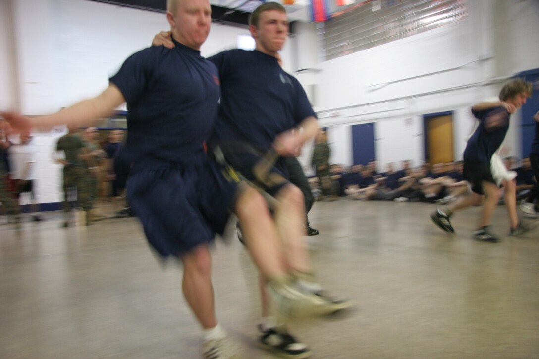 The three-legged race is a staple of field meets and factored into Recruiting Station Milwaukee's annual event. Some teams opted to try their luck with the normal legged walking motion while a couple decided on a method of synchronized hopping. This field meet is an annual event pitting the four metro-Milwaukee recruiting substation against each other in order to foster friendly competition which will prove useful for these poolees throughout their Marine Corps career.