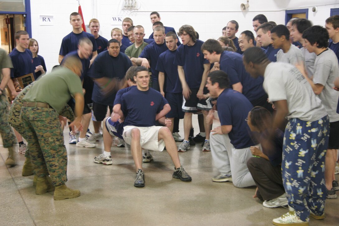 Robert Jicha, a poolee from Recruiting Substation North Milwaukee, endures the pain of the roman chair event during Recruiting Station Milwaukee's annual field meet here Feb. 14. The field meet pitted the four metro-Milwaukee substations against each other fostering friendly competition which will serve these poolees well throughout their Marine Corps career.