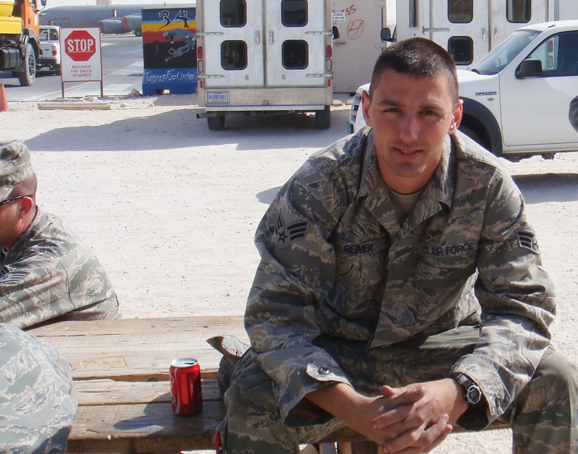 Senior Airman Travis Reimer takes a break during his recent deployment in Southest Asia. His workday was usually 13 hours long, six days a week, while deployed. Airman Reimer is a hydraulics mechanic assigned to the maintenance squadron of the 931st Air Refueling Group, an Air Force Reserve unit at McConnell Air Force Base, Kan. (Courtesy photo)                            
