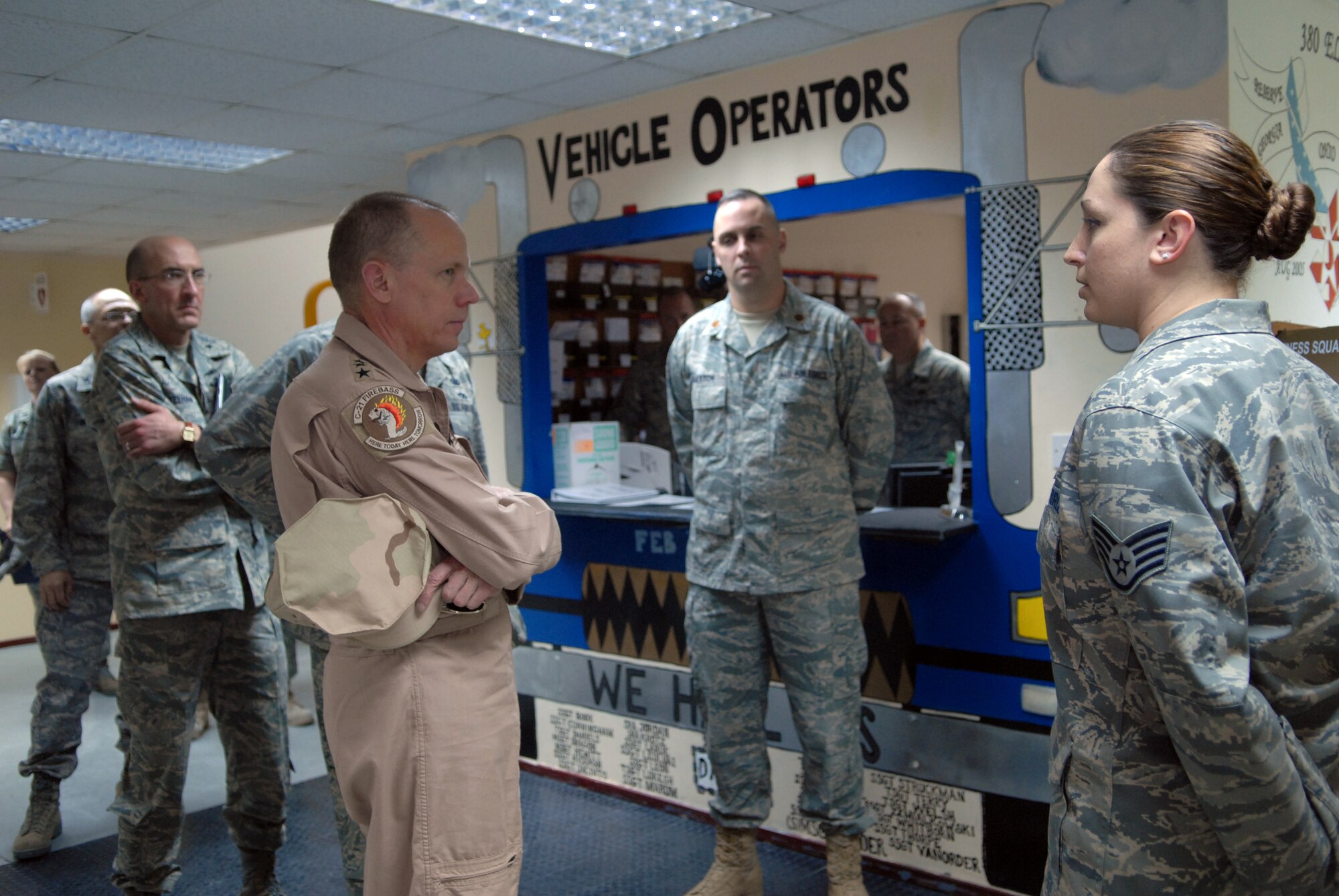 SOUTHWEST ASIA - Gen. Donald J. Hoffman, Air Force Material Command, commander, gets briefed by the 380th Expeditionary Logistics Readiness Squadron, vehicle operations flight, Feb 12. General Hoffman was briefed on the 380th ELRS, vehicle operations mission and how they tie into the mission of the entire 380th Air Expeditionary Wing and the challenges the wing has overcome to consistently fly the air tasking order. General Hoffman is touring the AOR to see each bases capabilities and what they bring to the war on terror. (U.S. Air Force photo by Captain Jennifer Pearson) (Released)