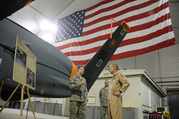 SOUTHWEST ASIA - Gen. Donald J. Hoffman, Air Force Material Command, commander, gets briefed about the RQ-4 Global Hawk at the 380th Air Expeditionary Wing, Feb 12. General Hoffman was briefed on the maintenance and operations side and what it takes to keep the RQ-4 in the sky and the challenges the wing has overcome to consistently fly the air tasking order. General Hoffman is touring the AOR to see each bases capabilities and what they bring to the war on terror. (U.S. Air Force photo by Senior Airman Brian J. Ellis) (Released)