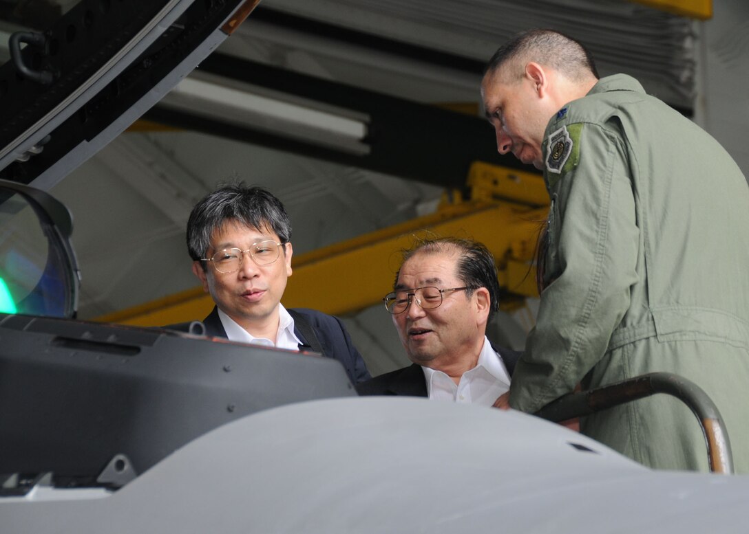 ANDERSEN AIR FORCE BASE, Guam - Lt. Col. Orlando "Slider" Sanchez, 90th Expeditionary Fighter Squadron F-22 Raptor pilot, explains the F-22A Raptor’s capabilities to Seigo Kitamura, Japan’s Senior Vice Minister of Defense, during a site visit to here Feb. 14. During his tour, Mr. Kitamura received a mission briefing about the 36th Wing and the annual Cope North exercise. U.S. and Japanese forces completed the annual two-week bilateral exercise Feb. 13. The exercise was designed to increase interoperability between the two nations. (U.S. Air Force photo by Senior Airman Nichelle Griffiths)