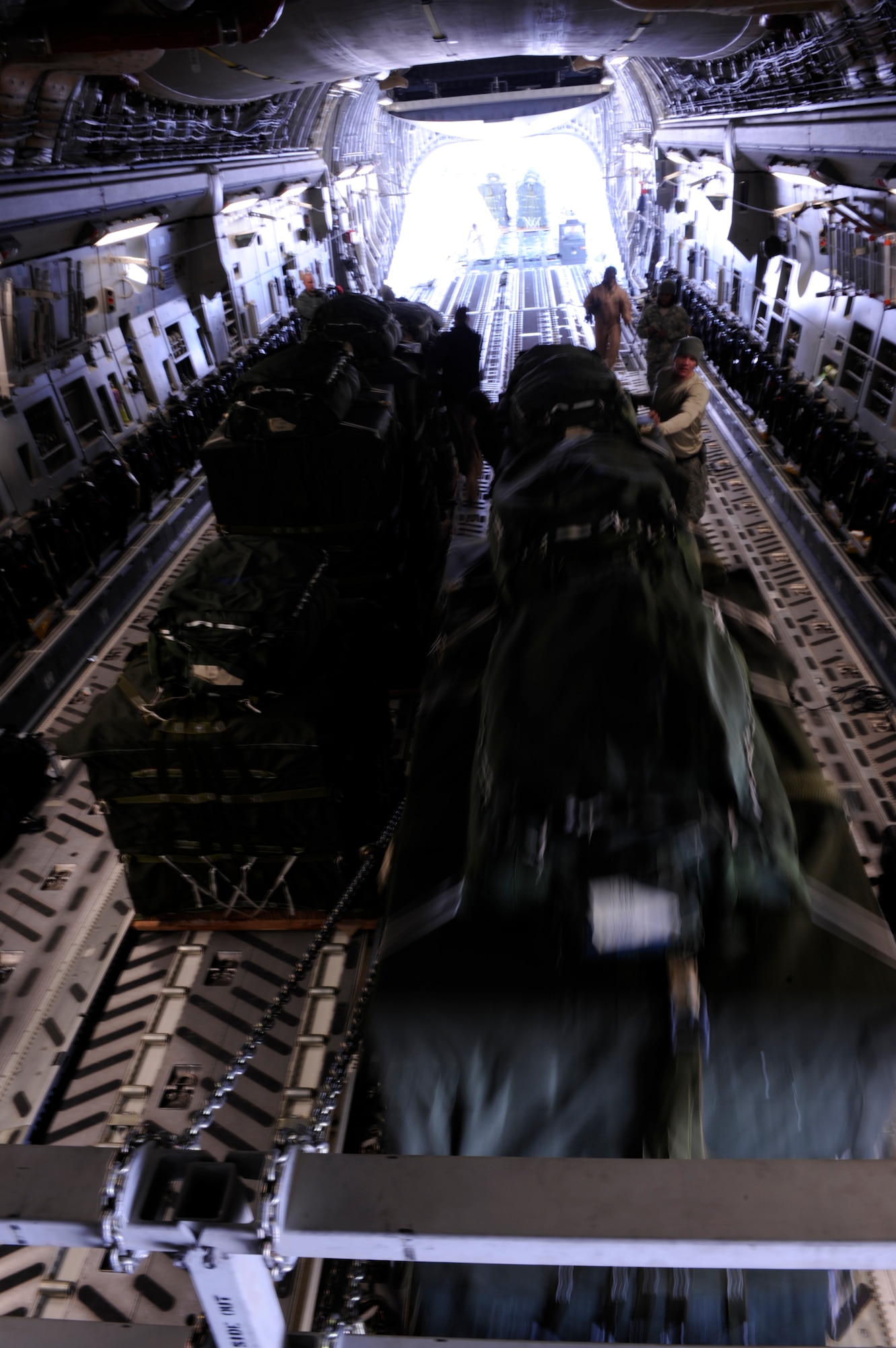 A C-17 Globemaster III aircrew from the 816th Expeditionary Airlift Squadron loads Container Delivery System (CDS) bundles onto the aircraft prior to an airdrop mission in Afghanistan on Feb. 14, 2009, in support of Operation Enduring Freedom. (U.S. Air Force photo by Staff Sgt. James L. Harper Jr.)Released