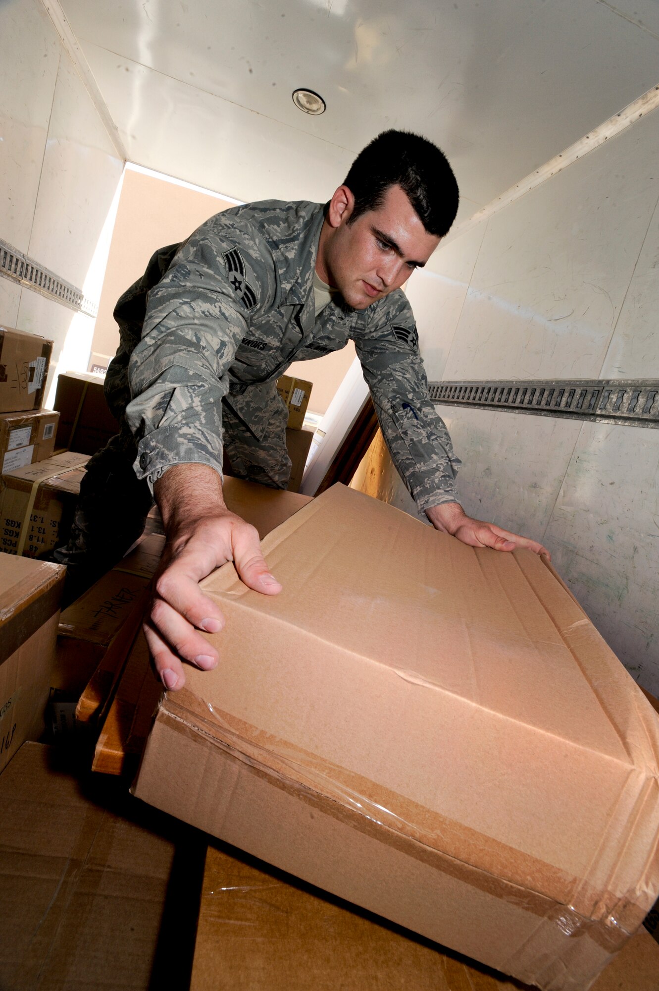 Senior Airman Joseph Connors, the 379th Expeditionary Logistic Readiness Squadron Bank Purchase Manager for the Desert Depot, off-loads a supply truck, Feb. 14, 2009, in an undisclosed location in Southwest Asia.  Airman Connors handles the requisition of supplies through local vendors in the area to supply the base with general items.  Airman Connors is native to Huntington Beach, Calif. and is deployed from Davis-Monthan Air Force Base, Ariz. in support of Operations Iraqi and Enduring Freedom and Combined Joint Task Force - Horn of Africa.  (U.S. Air Force Photo by Staff Sgt. Joshua Garcia/released)