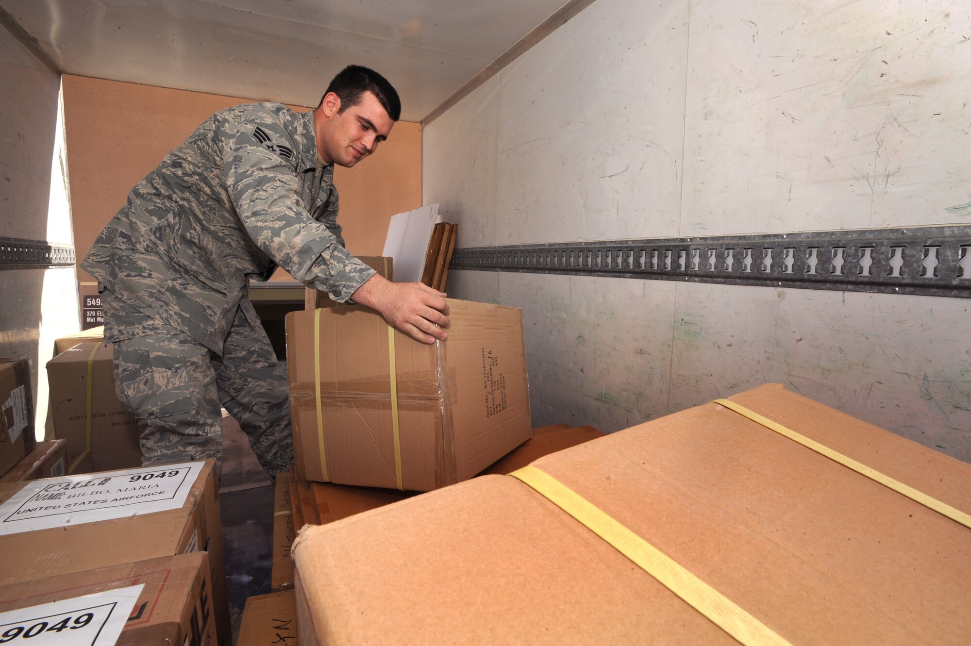 Senior Airman Joseph Connors, the 379th Expeditionary Logistic Readiness Squadron Bank Purchase Manager for the Desert Depot, off-loads a supply truck, Feb. 14, 2009, in an undisclosed location in Southwest Asia.  Airman Connors handles the requisition of supplies through local vendors in the area to supply the base with general items.  Airman Connors is native to Huntington Beach, Calif. and is deployed from Davis-Monthan Air Force Base, Ariz. in support of Operations Iraqi and Enduring Freedom and Combined Joint Task Force - Horn of Africa.  (U.S. Air Force Photo by Staff Sgt. Joshua Garcia/released)
