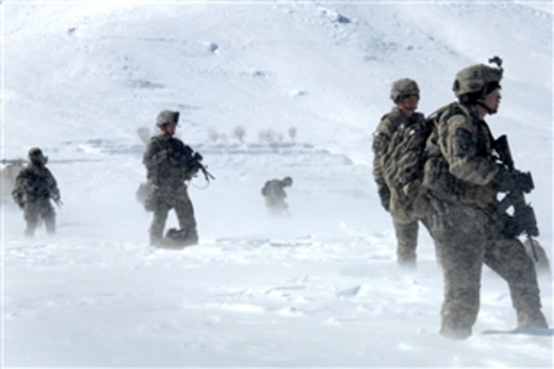 U.S. soldiers assigned to 101st Airborne Division's Personal Security Detail provide security amid swirling snow during an operation in Bagram, Afghanistan, Feb. 15, 2009.