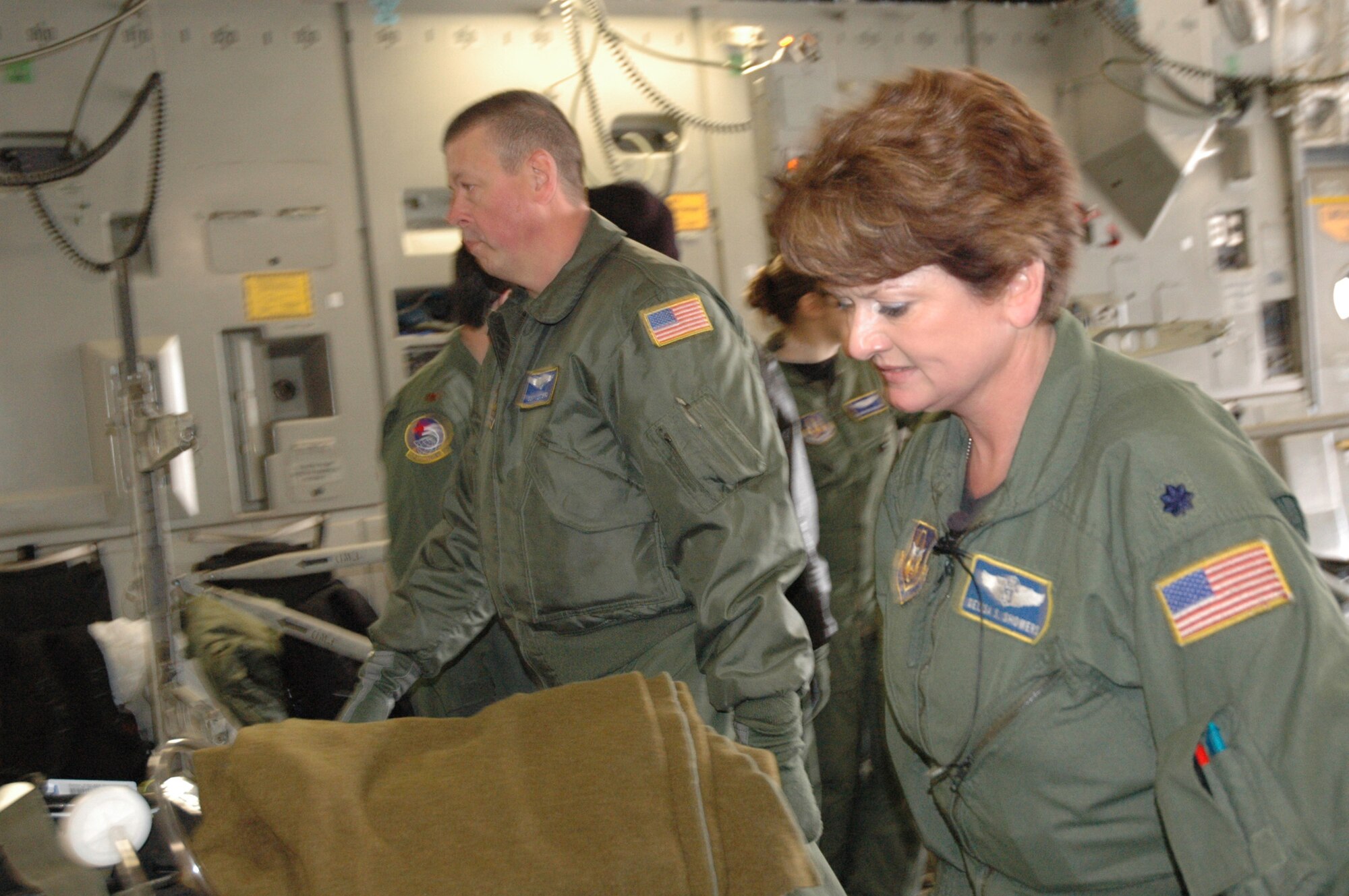 Lt. Col. Delisa Showers, 459th Aeromedical Evacuation Squardon, transports a patient onto a C-17 Sunday as part of the Aeromedical Jamboree. The event, which took place Saturday and Sunday, included aeromedical squadrons from six bases around the country. Participants completed training aboard C-130s, C-17s and KC-135s.