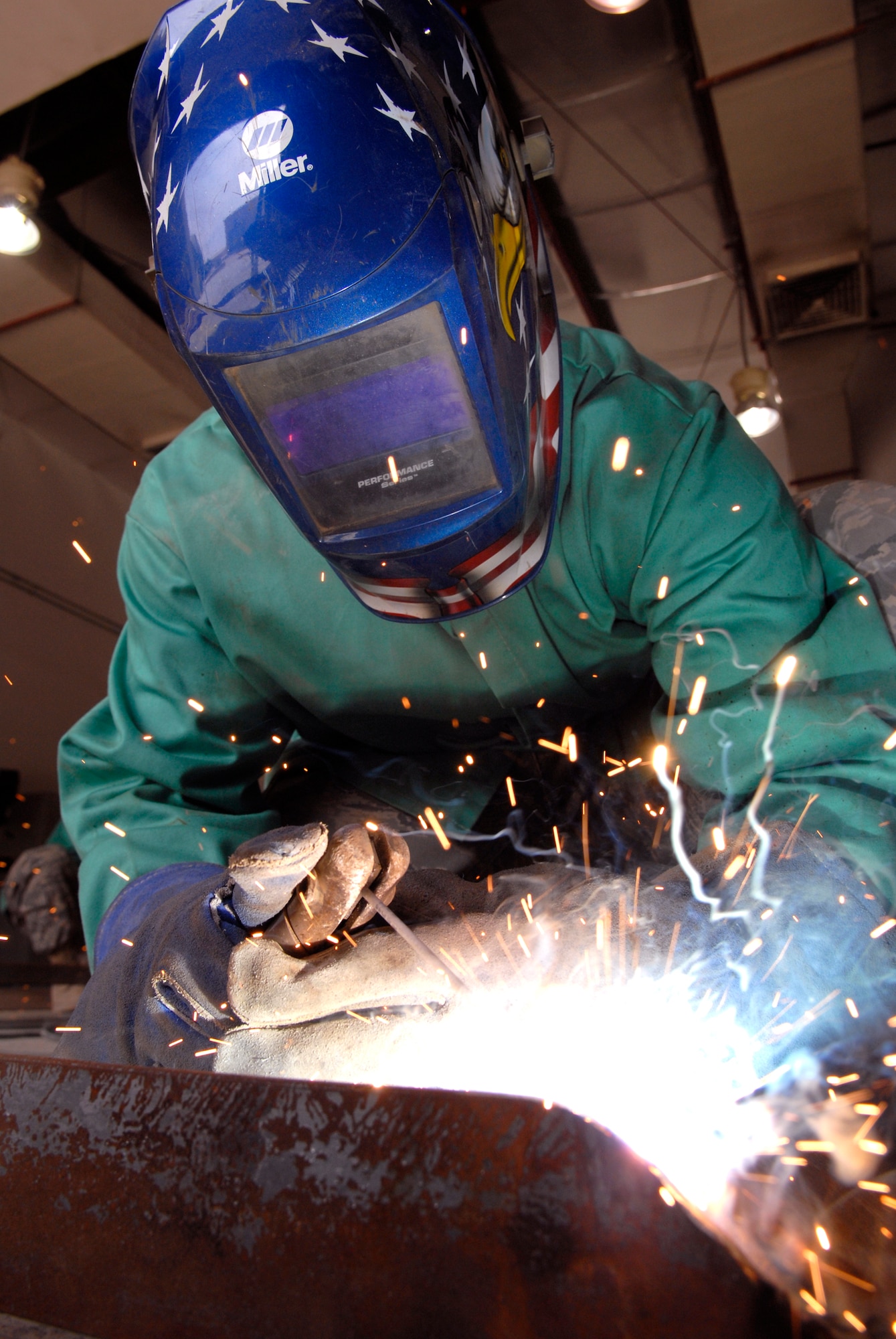 Staff Sergeant Evan Bellamy, a 379th Expeditionary Civil Engineer Squadron Structural Craftsman, welds a Foreign Object Debris (FOD) checker from angle iron beams to facilitate rock removal from vehicle tires at flight line entry control points, Feb. 15, 2009, at an undisclosed location in Southwest Asia.  Staff Sgt. Bellamy hails from Sullivan County, N.Y. and is deployed from Dover Air Force Base, Del. in support of Operation Iraqi and Enduring Freedom and Combined Joint Task Force - Horn of Africa.  (U.S. Air Force Photo by Airman 1st Class Andrew Satran/Released)