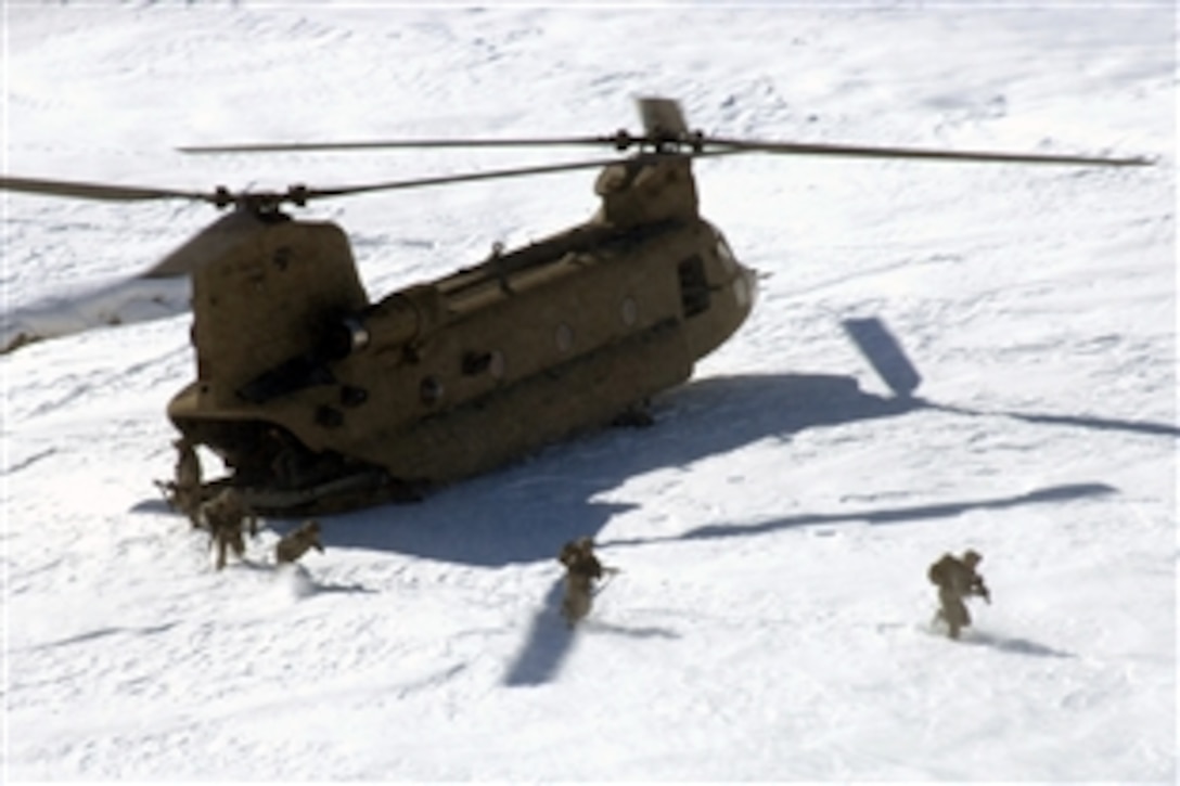 U.S. Soldiers of the 101st Airborne Division Personal Security Detail exit a CH-47 Chinook helicopter to provide security in Bagram, Afghanistan, Feb. 15, 2009.