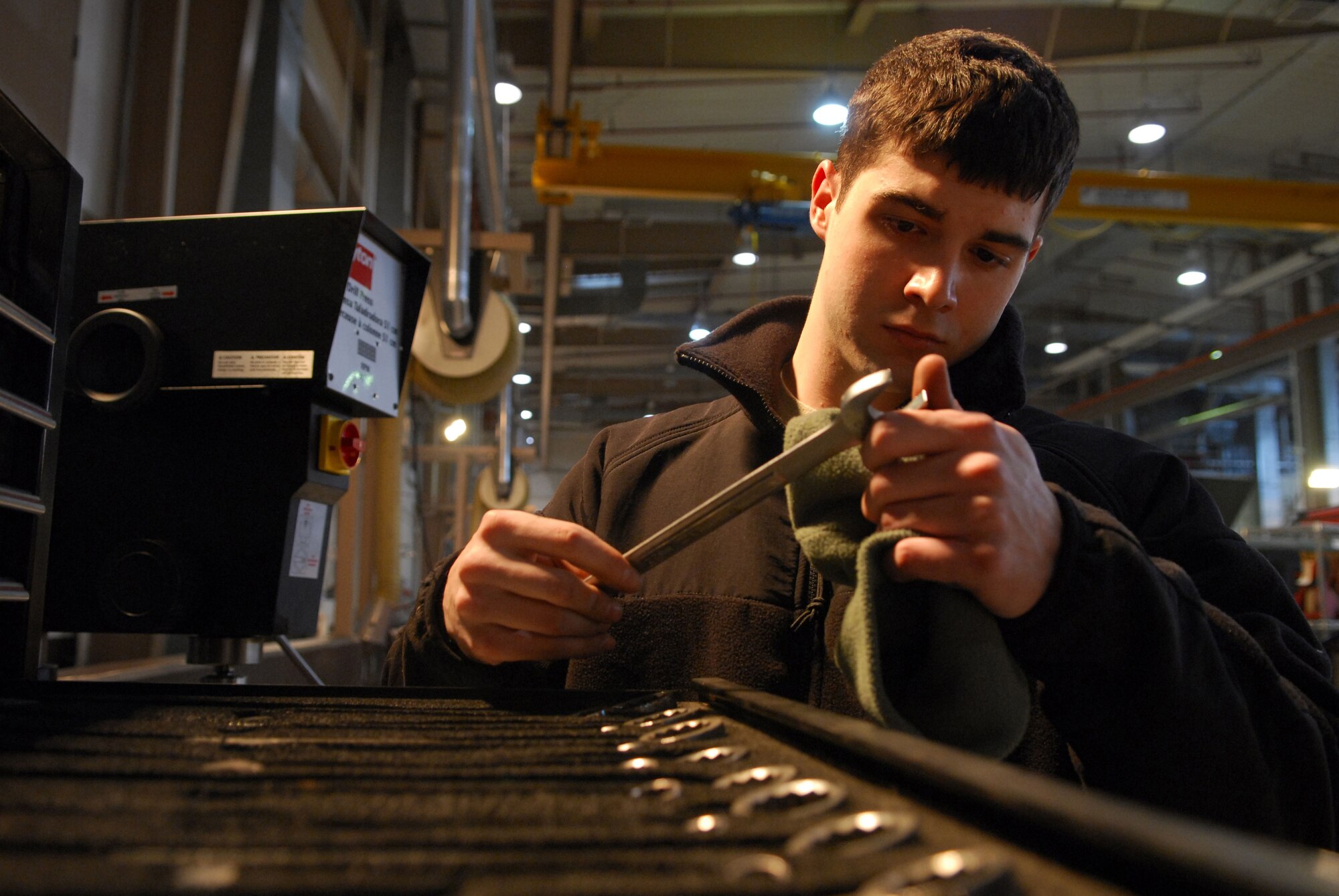 Airman 1st Class Shane McDonald performs a tool inspection prior to starting work on a turbo diesel engine at Osan AB, Republic of Korea Feb. 3. Airman McDonald is a vehicle mechanic assigned to the 51st Logistics Readiness Squadron. (U.S. Air Force photo/Senior Airman Christopher Boitz)