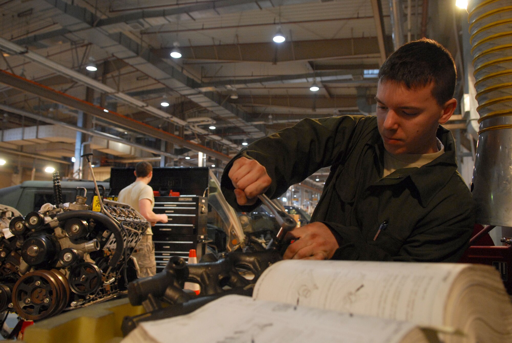 Senior Airman Jeff Maurer torques a crankcase-to-head on a diesel engine at Osan AB Republic of Korea Feb. 3. Airman Maurer is a vehicle mechanic assigned to the 51st Logistics Readiness Squadron. (U.S. Air Force photo/Senior Airman Christopher Boitz) 