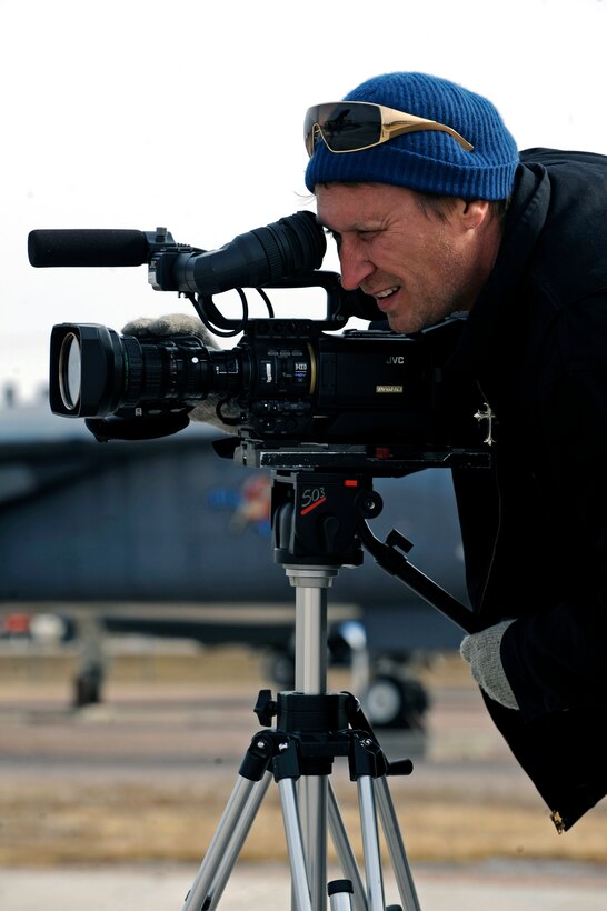 Jay Barbani, Speed Channel’s "American Thunder" producer, films a scene for an upcoming episode at the South Dakota Air and Space Museum, Feb. 11. Mr. Barbani was filming Tech. Sgt. Steven Wilson, 28th Bomb Wing Public Affairs NCO in charge, giving Colby Donaldson, host of American Thunder, a tour of the museum for a segment of an upcoming episode focusing on attractions and cultural icons of the Black Hills area. (U.S. Air Force photo/Airman 1st Class Matthew Flynn)