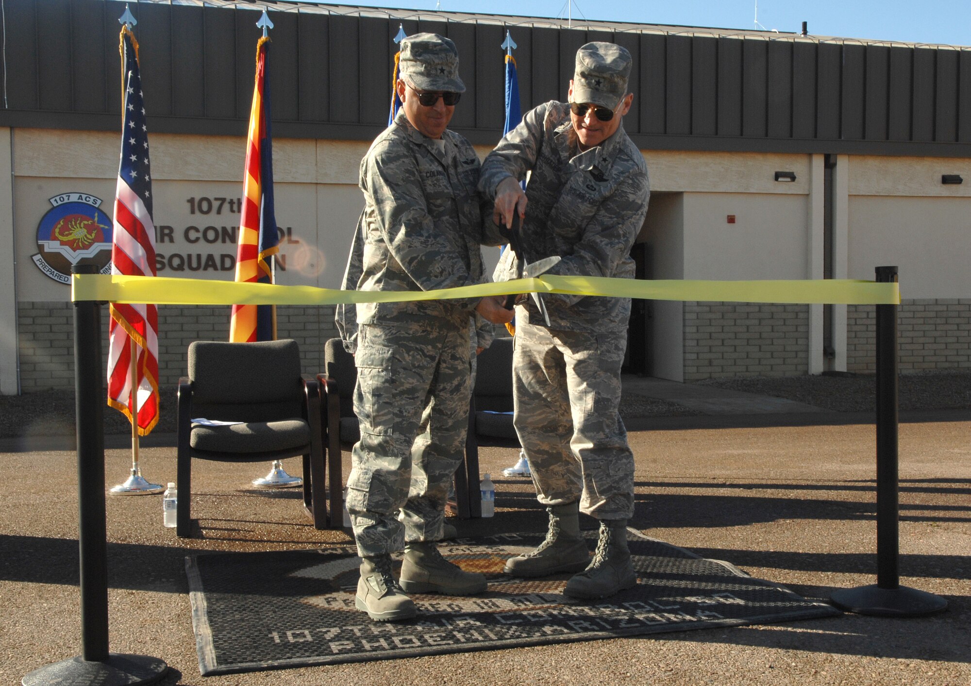 Brig. Gen.  Michael G. Colangelo, Arizona National Guard commander, and Brig. Gen. Kurt Neubauer, 56th FW commander, perform the ribbon cutting for the 107th Air Controller Squadron's new facility at Luke AFB.  (A.F. Photo by Tech. Sgt. Jeffrey A. Wolfe)
