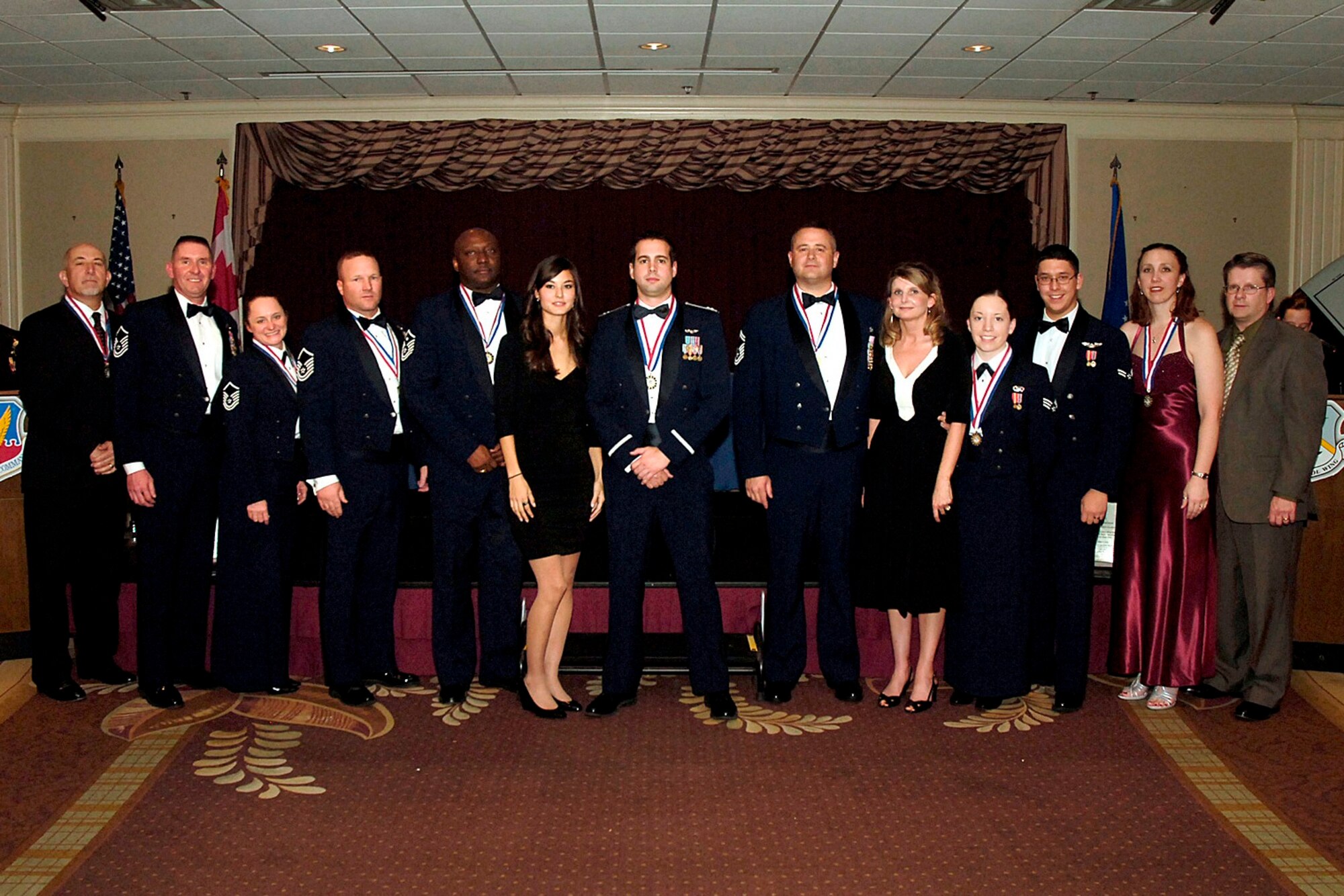 The 552nd Air Control Wing Annual Award Winners 2008, Left to right: Mr. Brian D. Zbydniewski, Master Sgt Tate Beaufeaux, Master Sgt. Sheila A. Beaufeaux, Master Sgt. Joshua H. Phillips, Master Sgt. Laprell E. Ellis, guest and Capt. Levi A. Rains, Senior Master Sgt. Paul C. Balma and Mrs. Balma, Senior Airman Lacey M. Echeverry, Airman First Class Jeffrey Echeverry, and Ms. Julie A. Cook and Mr. Cook. 