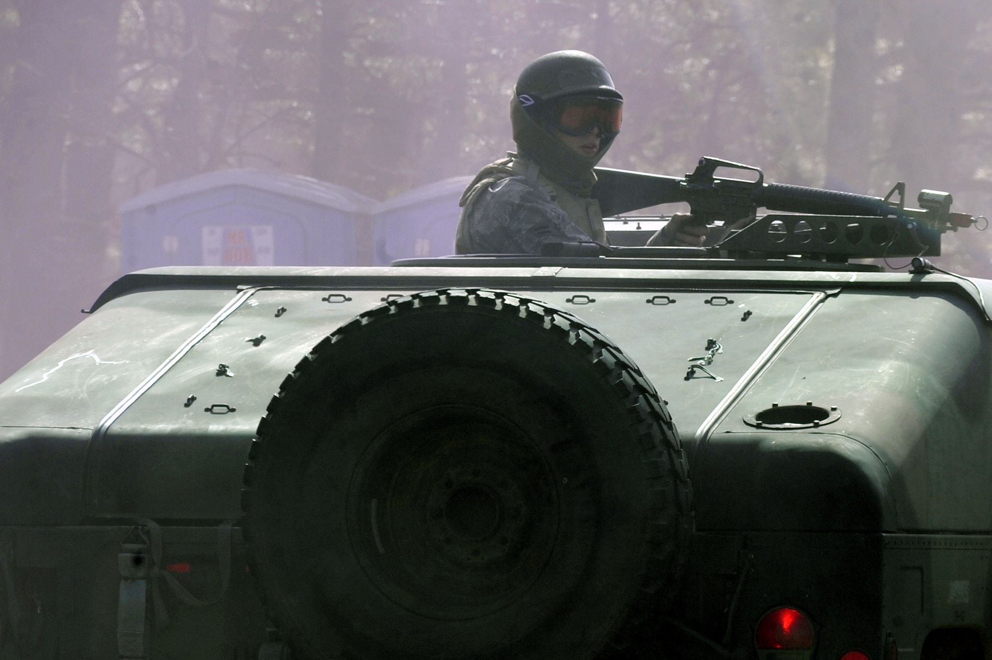 A student in the Air Force Advanced Contingency Skills Training Course reacts to a scenario during convoy operations training on Feb. 17, 2009, at a range on Fort Dix, N.J.  The course is taught by the U.S. Air Force Expeditionary Center's 421st Combat Training Squadron, also at Fort Dix.  The course prepares Airmen for upcoming deployments through training in everything from convoy operations and combat first aid to patrolling and tactics.  (U.S. Air Force Photo/Staff Sgt. Nathan Bevier)