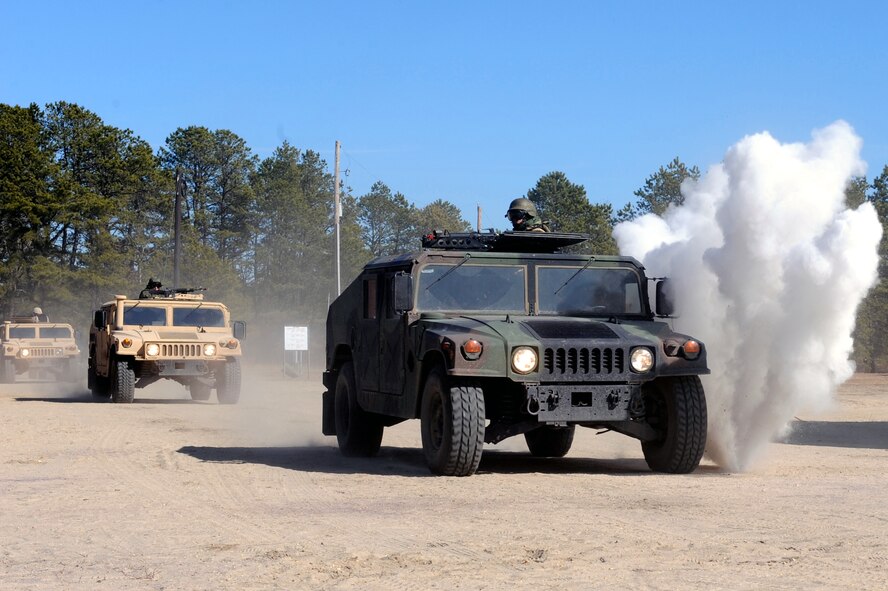 Students in the Air Force Advanced Contingency Skills Training Course react to a scenario during convoy operations training on Feb. 17, 2009, at a range on Fort Dix, N.J.  The course is taught by the U.S. Air Force Expeditionary Center's 421st Combat Training Squadron, also at Fort Dix.  The course prepares Airmen for upcoming deployments through training in everything from convoy operations and combat first aid to patrolling and tactics.  (U.S. Air Force Photo/Staff Sgt. Nathan Bevier)