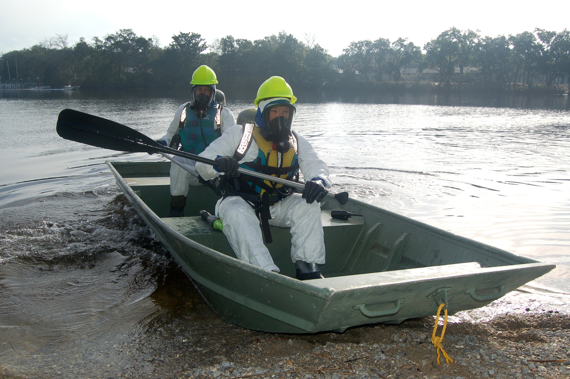 EGLIN AIR FORCE BASE, Fla. -- U.S. Coast Guard's Petty Officer 1st Class Stephanie Rathburn, Marine Safety Unit, Wilmington, N.C., and Petty Officer 3rd Class Carl Shepard, Marine Science Technician, North Carolina Sector, bring their boat ashore after assessing the simulated spill area in Weekly Bayou during a spill response exercise.(U.S. Air Force photo/Jerron Barnett) 