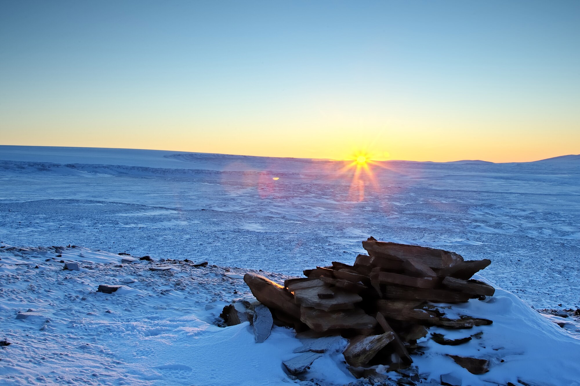 The sun rises over Thule Air Base Feb. 11 for the first time since Oct. 31. Thule will gain about 20-30 minutes of sunlight each day until about April 21, where the sun will remain in the sky until Aug. 19 (Photo by Master Sgt. Ben Huseman).