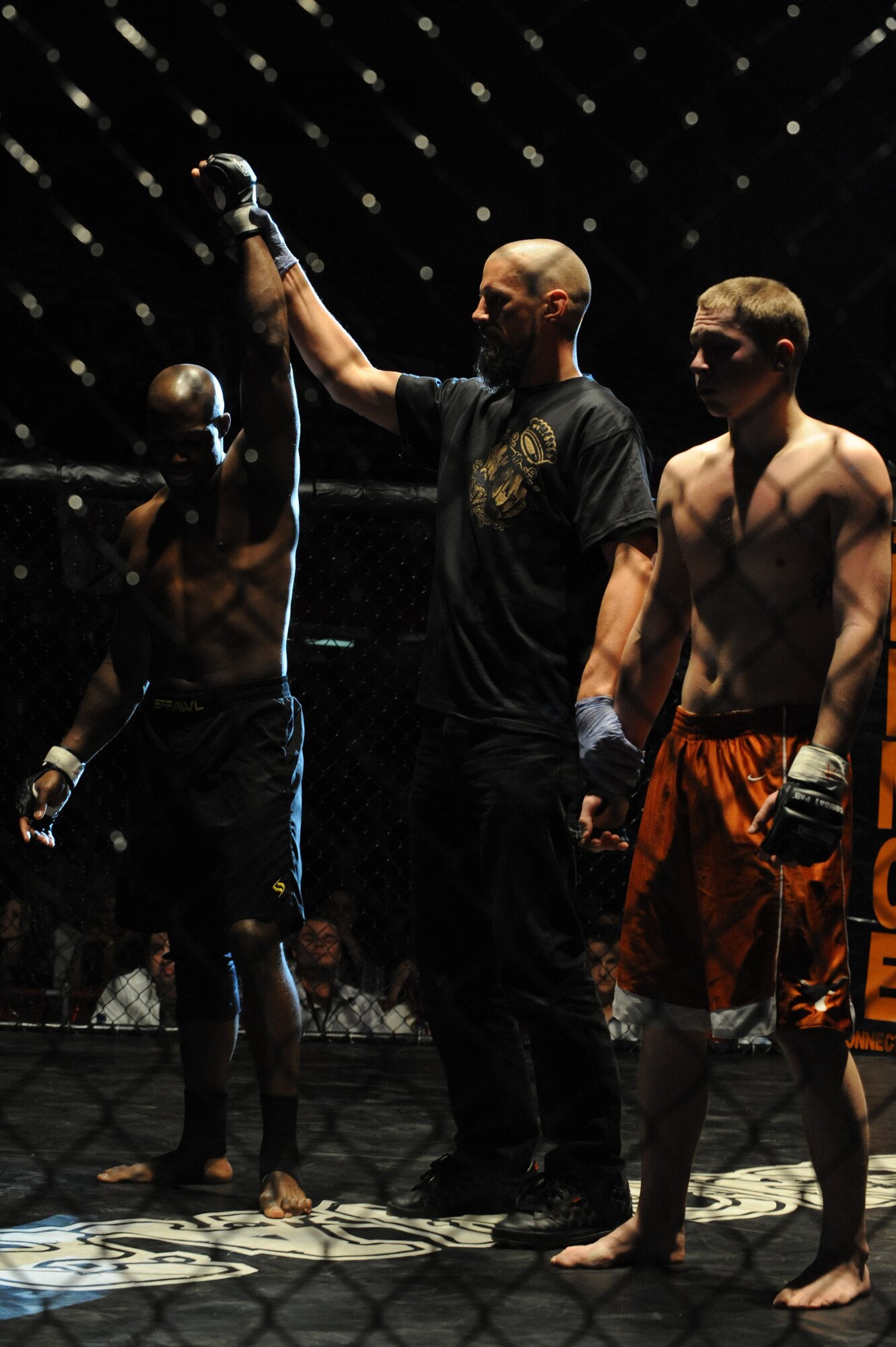 (Left) Second Lt. Jason Carter, 28th Medical Group group practice manager, is declared winner by submission after the first round of his match against Hugh Foreman at the Rushmore Plaza Civic Center in Rapid City, S.D., Feb. 13. Lieutenant Carter’s been training in Judo for about ten years and over the past seven months started training in Muay Thai kickboxing and Brazilian Jiu-Jitsu. (U.S. Air Force photo/Airman 1st Class Adam Grant)