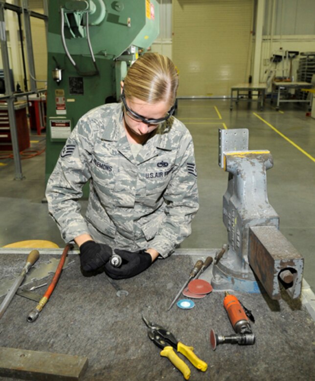 Staff Sgt. Lynn Plemons, 305th Maintenance Squadron Maintenance Fabrication Flight training manager, prepares a drill bit for a pneumatic air drill. Sergeant Plemons has been in the Air Force for six years and was recently featured in South Jersey Magazine for her outstanding work at McGuire. (U.S. Air Force photo/Carlos Cintron)