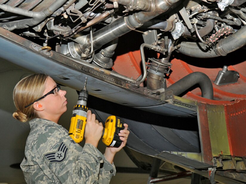 Staff Sgt. Lynn Plemons, 305th Maintenance Squadron Maintenance Fabrication Flight training manager, removes rivets on a KC-10 engine core cowl. Defective rivets or fasteners need to be removed and replaced with new ones. A-Check inspections are performed by crew chiefs; any discrepancies are then passed on to applicable specialists, such as aircraft structural specialists, hydraulics specialists and/or the metal or avionics shops. (U.S. Air Force photo/Carlos Cintron)