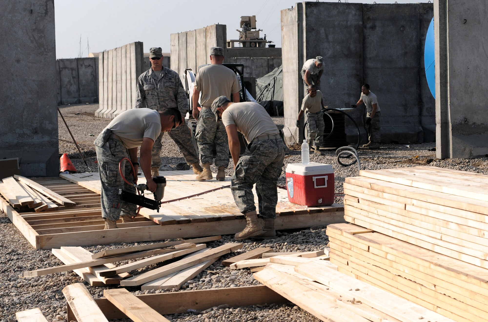 Joint expeditionary tasking Airmen from the 732nd Expeditionary Civil Engineer Squadron work together Feb. 7 to construct three shower units with five stalls in each. The team of JET Airmen, forward-deployed to Forward Operating Base Hunter, Iraq, is comprised of electricians, carpenters, pavement and equipment technicians, and plumbers who are here to improve the quality of life for Soldiers deployed here. (U.S. Air Force photo/Senior Airman Elizabeth Rissmiller)