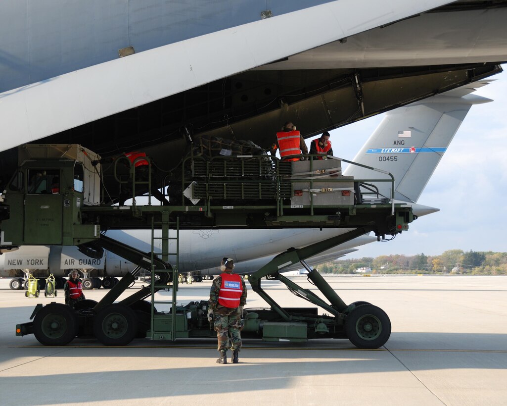 Stewart Air National Guard Base, 20 October 2007. Members of 105 Airlift Wing Logistics Readiness Squdron Cargo Deployment Function, CDF, Team off-loading deployed cargo after participating in the 875 Air Expeditionary Wing's Operational Readiness Exercise, ORE, held at Volk Field Combat Readiness Training Center, CRTC, W.I. (U.S. Air Force photo by Tech. Sgt. Michael OHalloran)