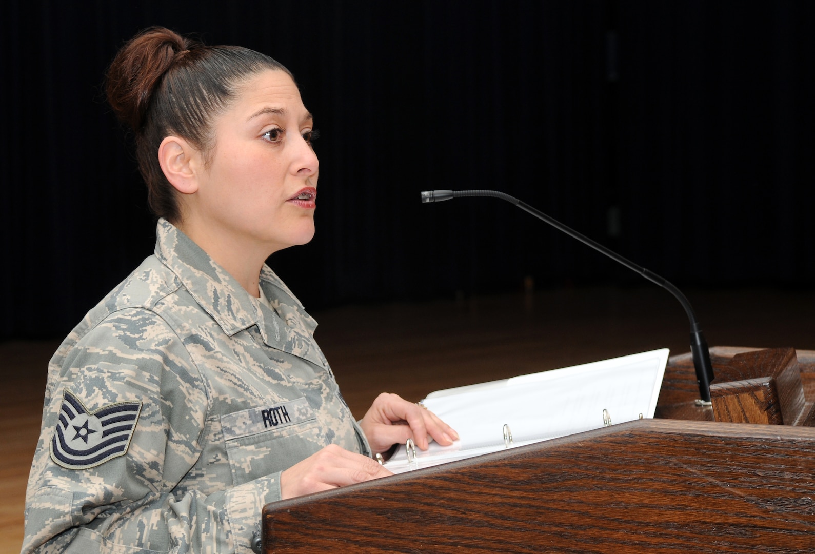 Tech. Sgt. Jennifer Roth, 12th Flying Training Wing chapel, reads scripture during the 2009 National Prayer Breakfast on Feb. 17. (U.S. Air Force photo by Rich McFadden)