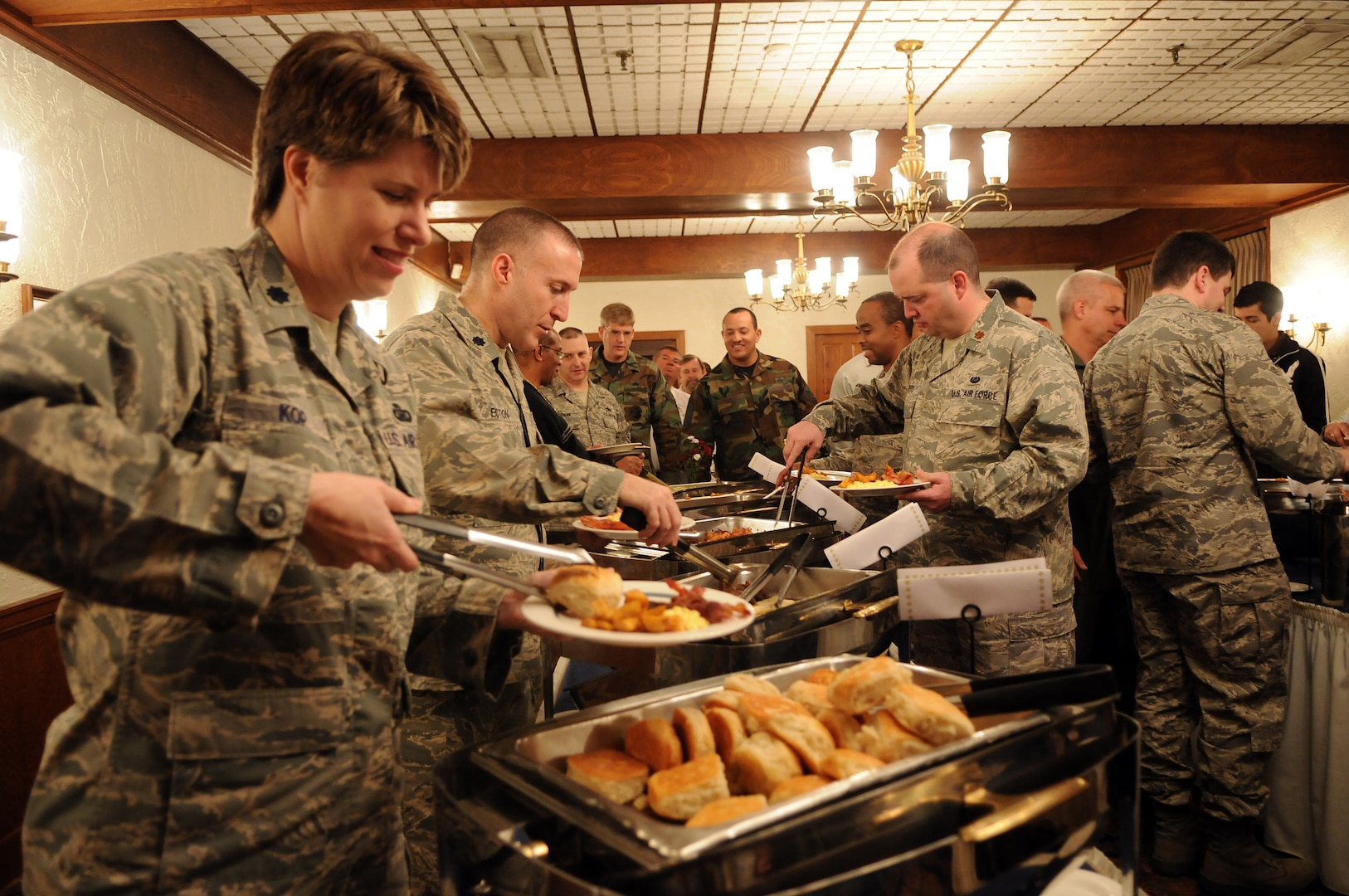 Airmen and defense department civilians help themselves to a buffet breakfast during the 2009 National Prayer Breakfast at the Parr Club on Feb. 17. (U.S. Air Force photo by Rich McFadden)