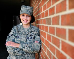 LANGLEY AIR FORCE BASE, Va. -- Airman 1st Class Cristina Bennett, 1st Force Support Squadron separations and reenlistment clerk, poses for a photo here Feb. 10.  Airman Bennett, a Romanian, joined the Air Force in February 2008 to enjoy a better life.  "Joining the Air Force was the best opportunity to improve my life," said Airman Bennett.  "I make mistakes and am still learning but I'm always positive. It was the right thing for me to do."  (U.S. Air Force photo/Senior Airman Vernon Young) 
