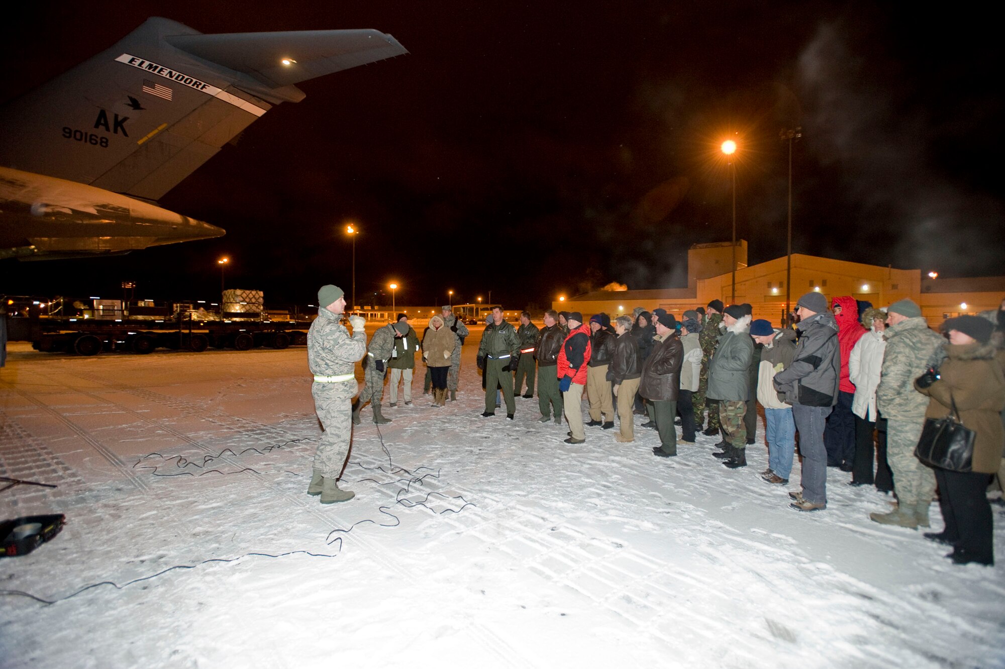 ELMENDORF AIR FORCE BASE, Alaska -- Senior Master Sgt. John Brindley, 732nd Air Mobility Squadron air freight superintendent, describes the harsh conditions of loading cargo onto C-17s in Alaska to the C-17 Executive Program Management Review members Feb. 11, 2009. The C-17 EPMR brought operators, maintainers and engineers together to discuss C-17 issues derived from the Alaskan winters. (U.S. Air Force photoSenior Airman Jonathan Steffen)
