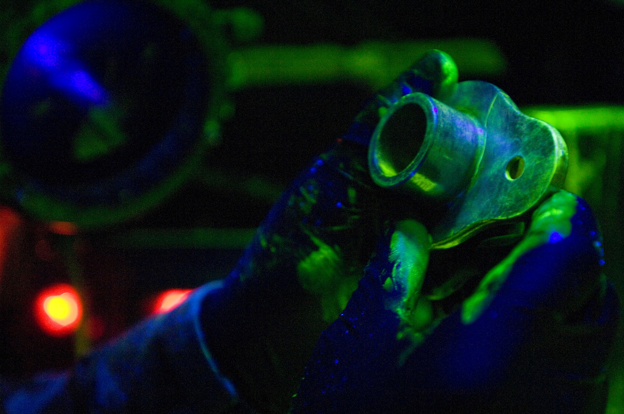 ELMENDORF AIR FORCE BASE, Alaska -- Airman 1st Class Anthony Thomas, 3rd Equipment Maintenance Squadron, points out a crack on engine cone Feb. 13, 2009. Airman Thomas uses florescent magnetic particles, a nondestructive inspection, to indicate a crack on the part. (U.S. Air Force photo/Senior Airman Jonathan Steffen)
