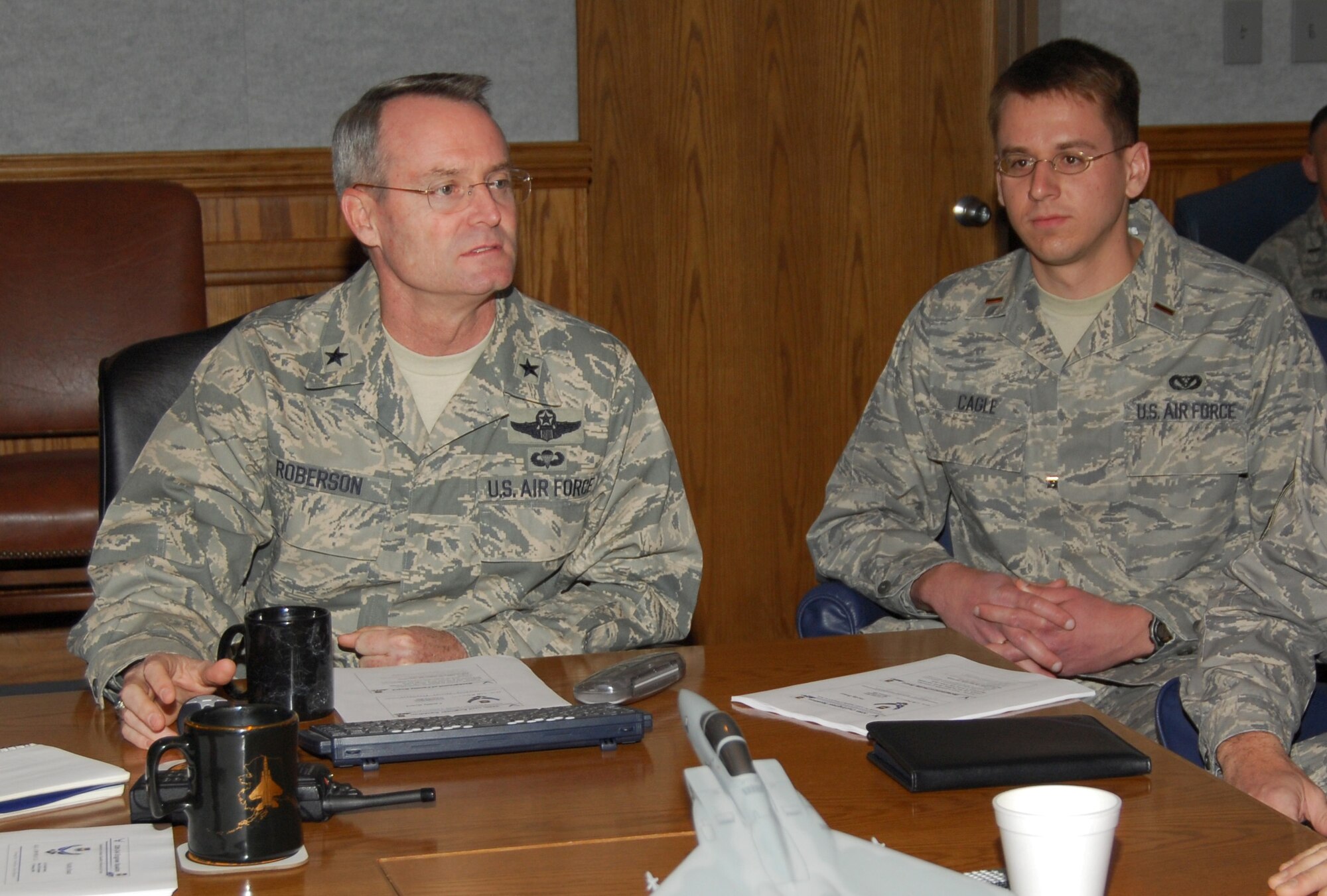 2nd Lt. Christopher Cagle, 325th Civil Engineer Squadron project manager, shadows Brig. Gen. Roberson, 325th Fighter Wing commander, during the commander’s staff meeting here today.  Lieutenant Cagle performs facility and infrastructure engineering including design, construction and renovations.  He also enforces applicable engineering building and safety codes, negotiates costs with contractors and builds project folders.  Lieutenant Cagle spent the day with General Roberson as part of the Commander’s Shadow Program.  He has more than a year in the military and is a native of Boiling Springs, N.C.  (U.S. Air Force photo by Lisa Norman)