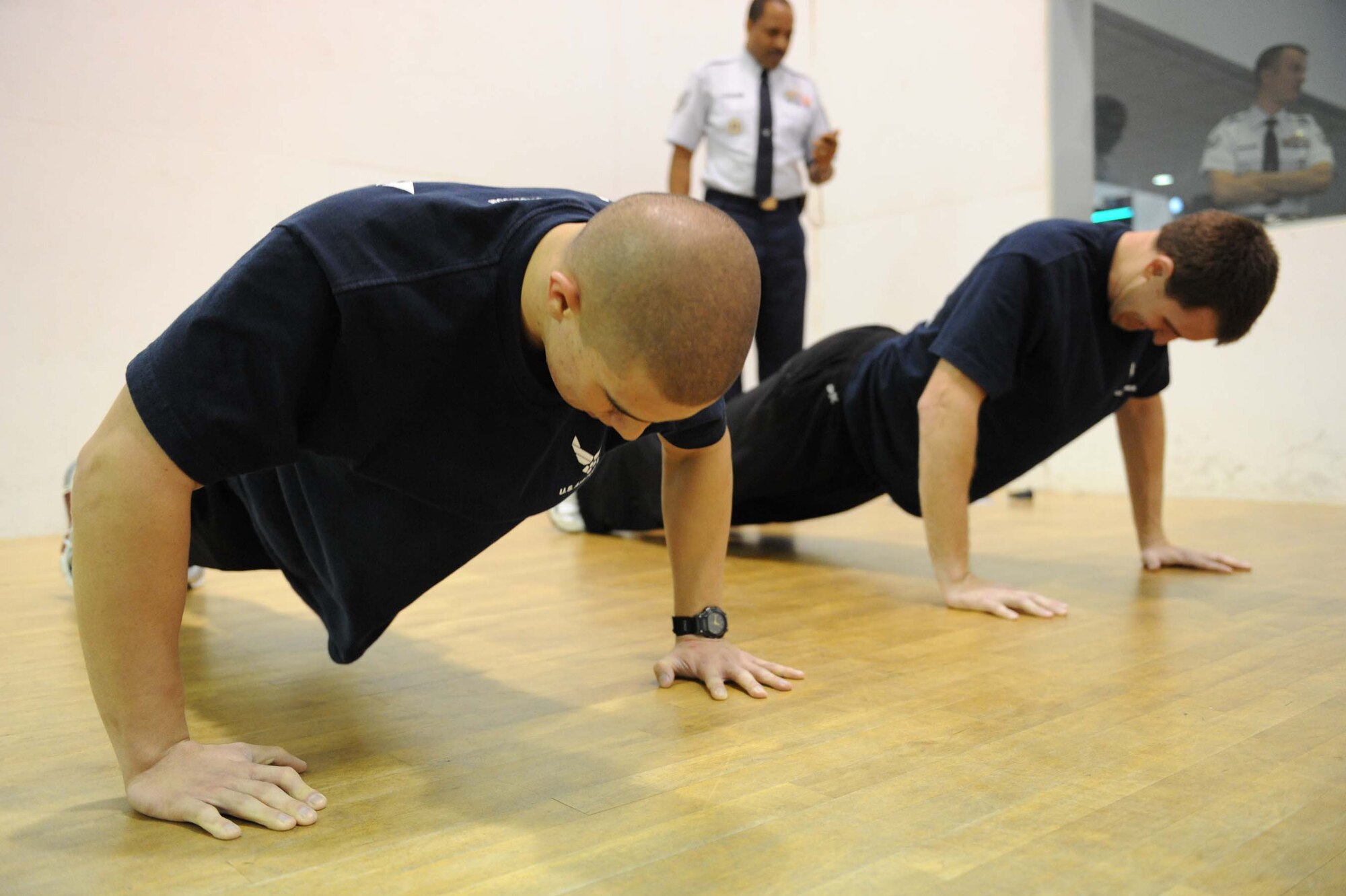 SHAW AIR FORCE BASE, S.C. -- Joshua Atwood and Robbie Clark complete the push-up portion of a physical assessment and stamina test (PAST) for U.S. Air Force special tactics Feb. 13. Recruits in the delayed entry program must complete the PAST to qualify for special tactics. (U.S. Air Force photo/Senior Airman Matthew Davis)